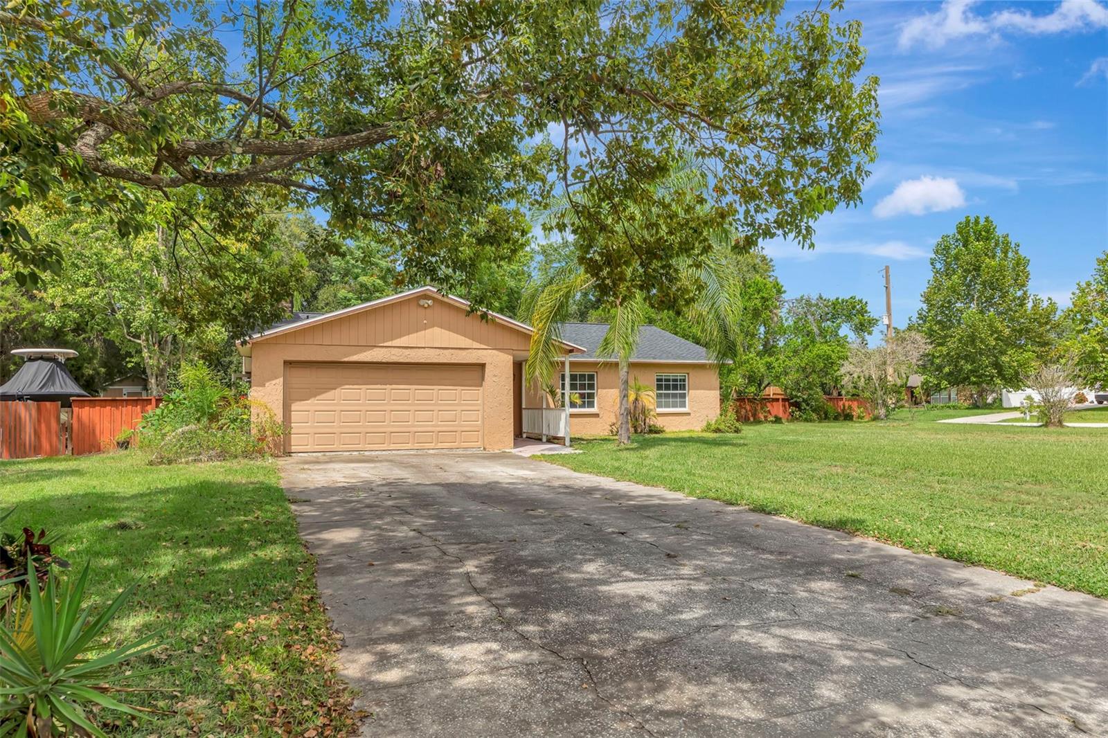 Welcome to 29453 Pomello Trace in beautiful Wesley Chapel!
This charming 3-bedroom, 2-bath home is ready to become your very own Florida paradise. Thoughtfully updated with luxury upgrades, you’ll find granite countertops, soft-close cabinetry, and newer stainless-steel appliances in the spacious kitchen—perfect for cooking and entertaining. The three bedrooms are vast with great closet space.
Both bathrooms have been newly renovated, adding modern comfort and style. Newer Roof 2024. The generous .57-acre lot offers room to breathe, with fruit trees, multiple gardens, and serene outdoor spaces to enjoy year-round. With its private well and septic system and no HOA fees, this home combines convenience with freedom.
Enjoy sipping your coffee poolside or gatherings next to the screened in-ground pool.