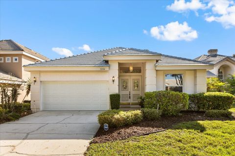 Photo of 7264 Hawksnest Boulevard, Orlando, FL 32835 (MLS # O6350754)