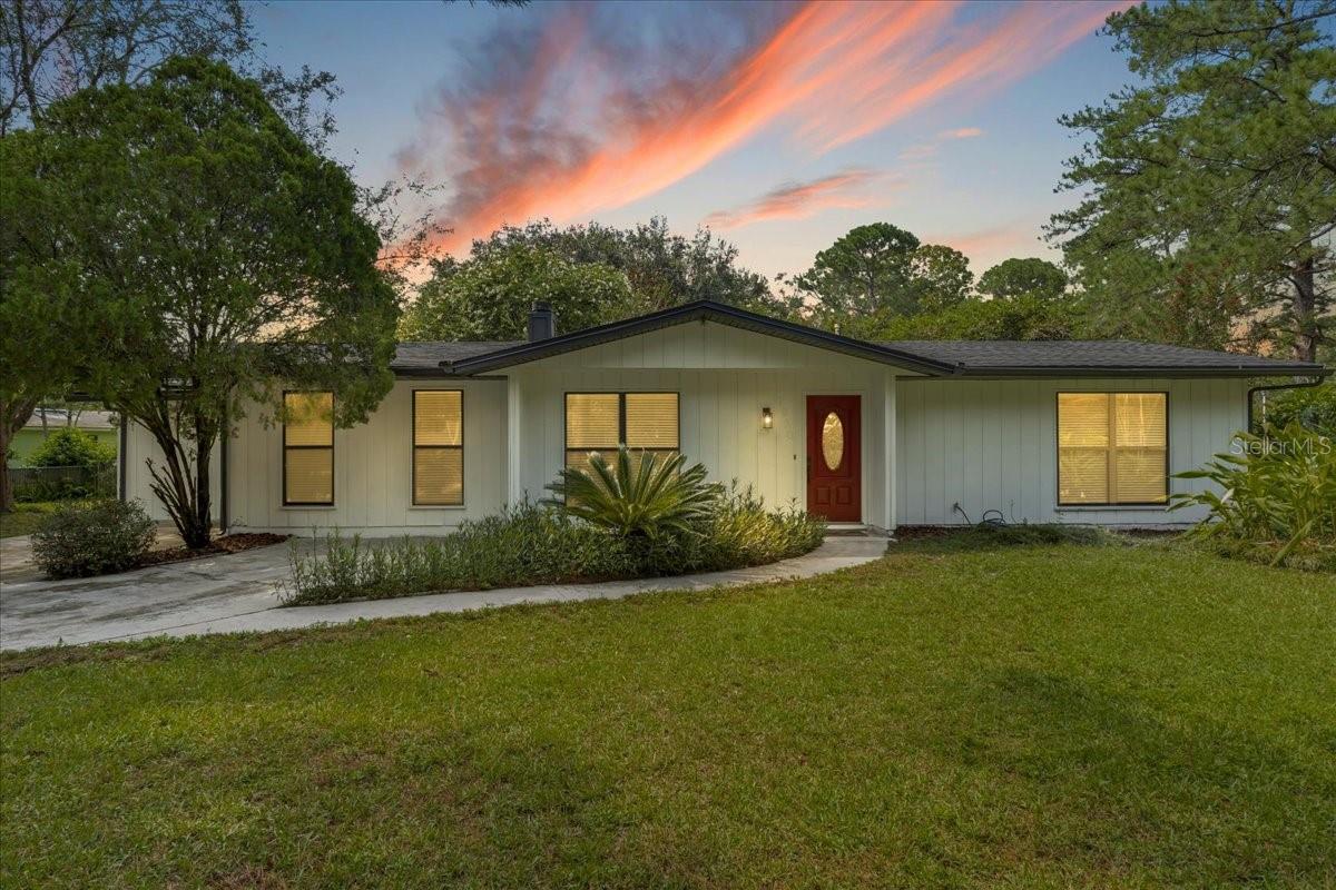 Have you been waiting for the perfect home to come on the market? This one is it! A 3 bedroom 2 bathroom home thoughtfully designed and tastefully updated. Experience the joy of a like-new home without having the price tag attached. Completed with a new roof, water heater, oak luxury vinyl flooring, light fixtures, and interior and exterior paint. Unwind in the primary suite and enjoy an expansive walk-in shower with dual shower heads, a custom bench, and elegant tile throughout. An additional room off of the primary bedroom can be easily converted into a home office, gym, or workshop. Entertain or relax effortlessly in the living/dining room enhanced by a cozy wood burning fireplace. Situated on a .26 acre corner lot with ample space to play and pets to frolic. Your dreams of owning a home with an amazing outdoor space are about to come true. Located right next to the YMCA, close to Publix shopping plaza, and a short distance to the University of Florida, Santa Fe, and all major hospitals. Don’t miss the opportunity to make this house your home. Call now to schedule a showing.