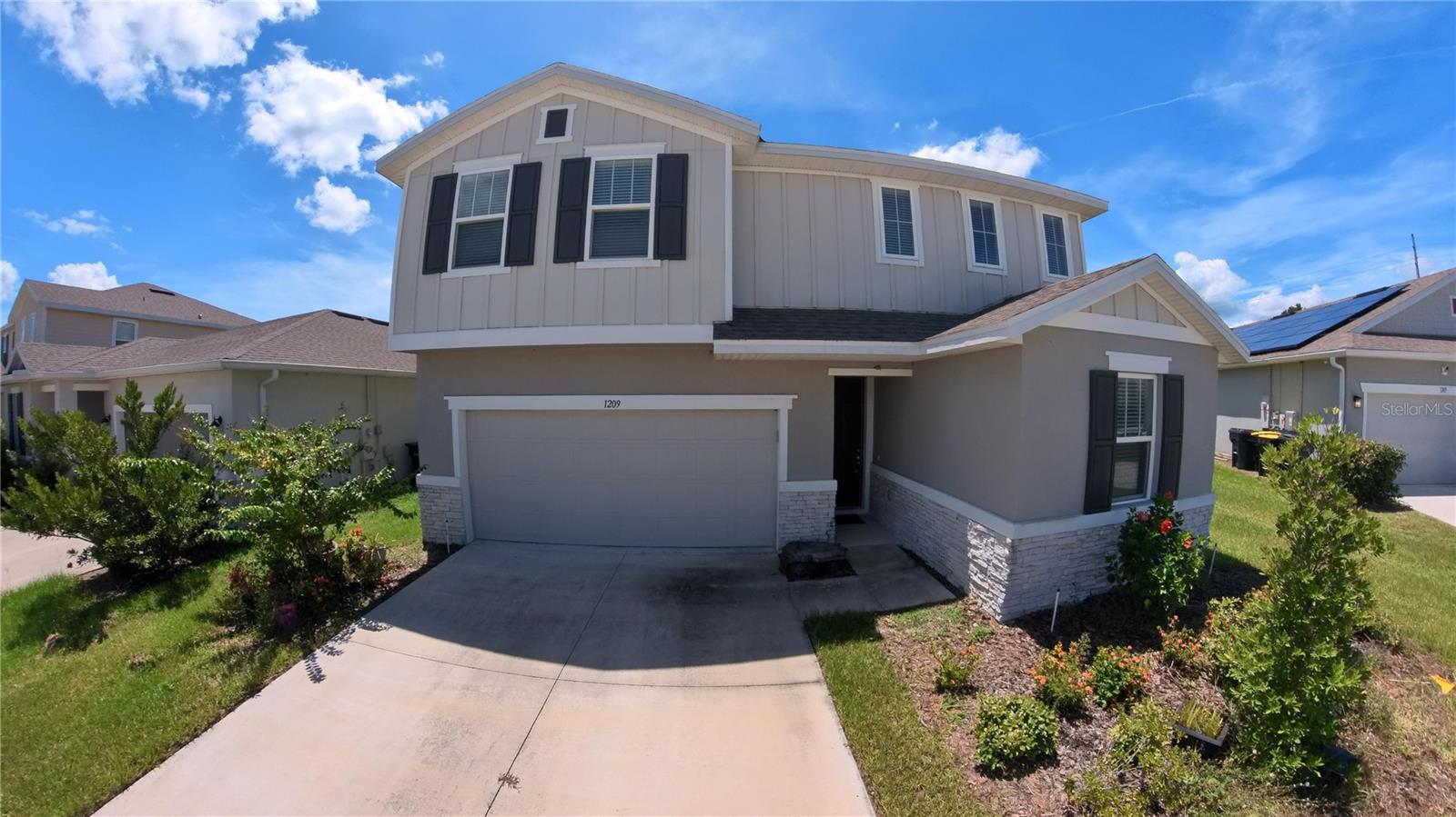 Step into this beautifully designed two-story home offering 5 bedrooms, 3 bathrooms, and a spacious 2-car garage. The open-concept layout features a modern kitchen with quartz countertops, stainless steel appliances, an oversized island with a sink, and rich espresso cabinets overlooking the backyard. Recessed lighting enhances the home’s warm, inviting feel, while the carpeted staircase leads to an upstairs loft perfect for a second living space or relaxation area. The primary suite boasts a generously sized bedroom and a stylish bathroom with dual sinks. An indoor laundry room adds extra convenience, and large windows throughout bring in natural light, making the space feel bright and airy. This home is ready for you to move in and enjoy. Ideally located near shopping, dining, and scenic lake.