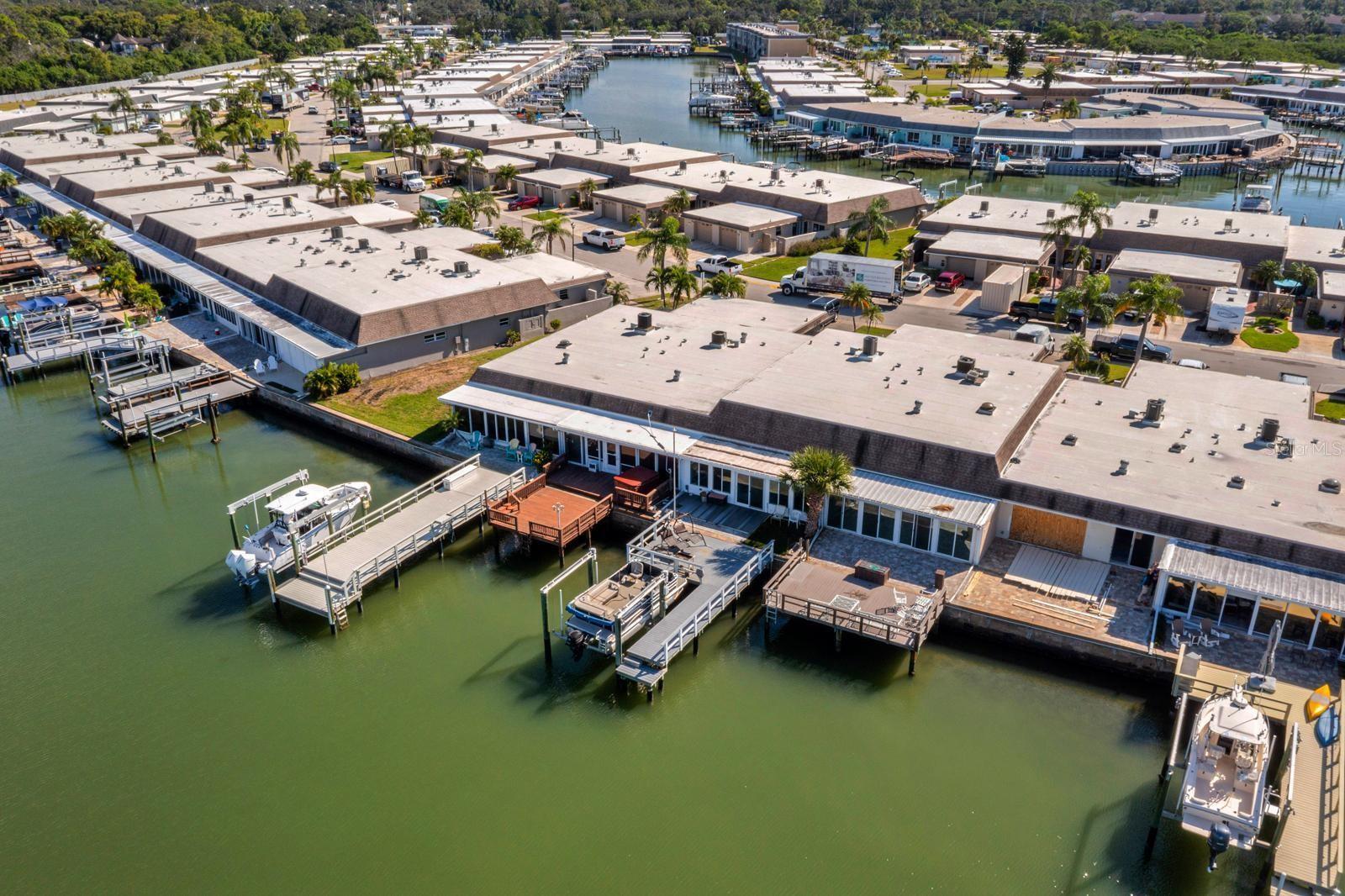 Welcome to 511 Boca Ciega Point #511, a rare waterfront villa in one of St. Petersburg’s most desirable gated, 55+ boating communities. With approximately 40 feet of private water frontage and direct Intracoastal Waterway access, this property offers the best of Florida coastal living — from morning coffee with dolphins in view to sunset cruises right from your backyard dock.
Inside, the home has already undergone major updates and is ready for your finishing touches. You’ll find open-concept living spaces, abundant natural light, and water views from the main living areas. Whether you’re envisioning a modern coastal retreat or classic Florida charm, this is your blank canvas to make it your own.
Step outside to your private patio overlooking the canal — perfect for relaxing, entertaining, or adding your personal touches like an outdoor kitchen or firepit. The community itself is known for its active social calendar, heated pool, clubhouse, fitness center, tennis courts, and deep-water canals with easy access to Boca Ciega Bay and the Gulf of Mexico.
Located just minutes from Madeira Beach, Treasure Island, and downtown St. Pete, you’ll enjoy the perfect blend of peace and proximity.
Very low assumable rate at 3%