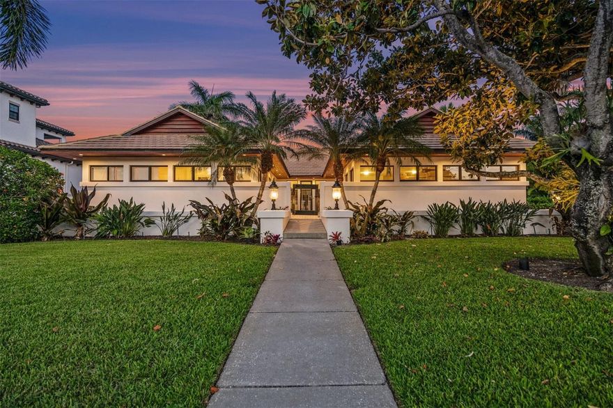 Nestled in the prestigious Bird Key Subdivision of Sarasota County, this remarkable mid-century modern home is a true architectural gem. Designed by renowned architect Tim Seibert of the Sarasota School of Architecture, this residence exudes elegance and sophistication. Boasting a timeless appeal, this home is a testament to exquisite design and craftsmanship. Upon entering this stunning home, you will be greeted by a seamless fusion of contemporary elements and mid-century charm. The interior has undergone a complete custom renovation to bring it up to the highest standards. With soaring ceilings, pecky cypress beams, and an abundance of natural light, the home offers a spacious and inviting atmosphere. The attention to detail is evident in every corner, from the Brazilian cherry hardwood floors to the sleek and modern fixtures. The open floor plan effortlessly connects the living spaces, creating an ideal setting for entertaining and relaxation. The kitchen and family room area is a true highlight, featuring solid wood cabinets, contemporary marble countertops, and a gas fireplace. The expansive glass folding doors provide seamless indoor-outdoor living and allow for breathtaking views of the lushly landscaped gardens. Step outside into the private courtyard, where you can unwind and enjoy the tranquility of the surroundings. Situated on a corner lot, this home offers privacy and serenity. The meticulously landscaped gardens provide a peaceful oasis and the perfect backdrop for outdoor gatherings. Bird Key Subdivision, a gated community with 24-hour guard service, offers a secure and exclusive living environment. Residents of Bird Key have access to a variety of amenities, including nearby marinas, beaches, and the vibrant city of Sarasota. Don't miss the opportunity to own this exceptional mid-century modern home in one of Sarasota's most sought-after neighborhoods. With its unparalleled design, luxurious finishes, and prime location, this residence will make you feel good when you come home. Come live in a garden!