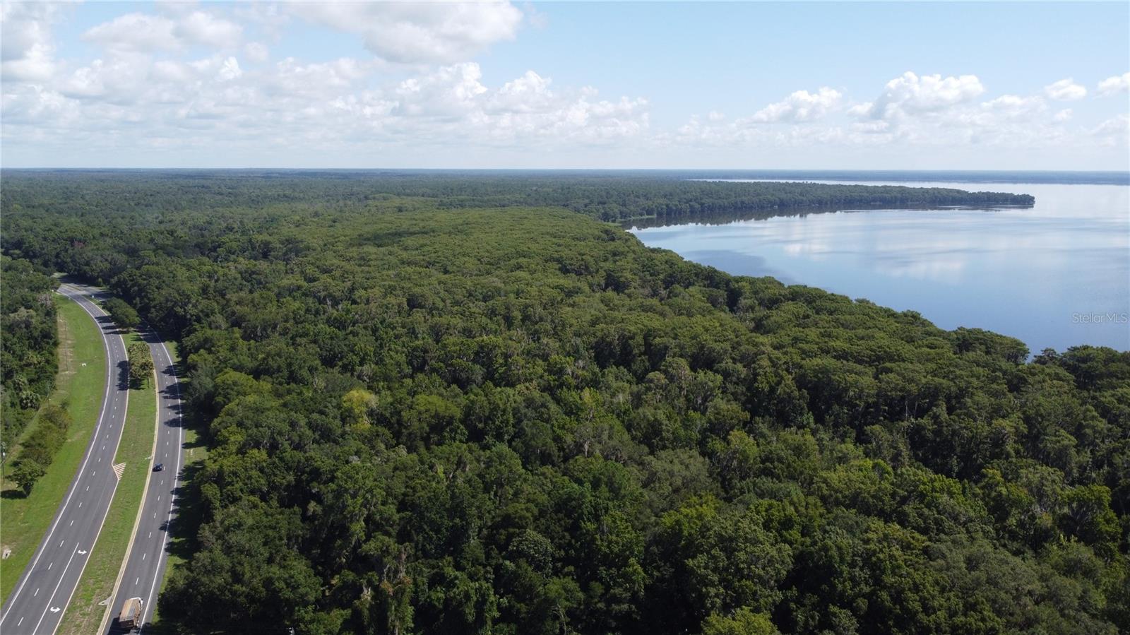 Part of a 3-parcel assemblage spanning Newnans Lake lakefront from Earl Powers Park to Lake Shore Drive. Assemblage also includes direct access to SE Hawthorne Road, Newnans Lake and Lake Shore Drive. The following additional parcels are included:
18000-000-000: 20 acres, $100,000. MLS: GC525202
18001-000-000: 54 acres, $325,000. MLS: GC523760
All three parcels can be purchased individually or the whole assemblage can be purchased at a bulk discounted price. Please contact agent directly to discuss plans and terms. Please see the attachments for a brochure for the whole assemblage!
This 7-acre parcel is the perfect mixed-use investment directly off SE Hawthorne Road. 3 of the 7 acres are high and dry and commercially zoned allowing for strong investment potential. The remaining 4 acres are wooded swampland. This land is in a great location, directly off of SE Hawthorne Road and adjacent to Newnans Lake, Newnans Lake Boat Ramp and Earl Powers Park.
When scouting or viewing the property, please be very conscious of the parcel boundaries. Due to its irregular shape, it can be easy to mistake the property lines.
It will not be obviously clear where the property lines begin and end, so please call for more information and/or take explicit note of the parcel boundaries on a map.