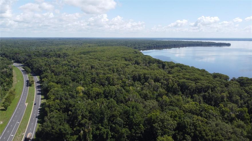 Part of a 3-parcel assemblage spanning Newnans Lake lakefront from Earl Powers Park to Lake Shore Drive. Assemblage also includes direct access to SE Hawthorne Road, Newnans Lake and Lake Shore Drive. The following additional parcels are included: 

18000-000-000: 20 acres, $100,000. MLS: GC525202
18001-000-000: 54 acres, $325,000. MLS: GC523760

All three parcels can be purchased individually or the whole assemblage can be purchased at a bulk discounted price. Please contact agent directly to discuss plans and terms. Please see the attachments for a brochure for the whole assemblage!

This 7-acre parcel is the perfect mixed-use investment directly off SE Hawthorne Road. 3 of the 7 acres are high and dry and commercially zoned allowing for strong investment potential. The remaining 4 acres are wooded swampland. This land is in a great location, directly off of SE Hawthorne Road and adjacent to Newnans Lake, Newnans Lake Boat Ramp and Earl Powers Park.

When scouting or viewing the property, please be very conscious of the parcel boundaries. Due to its irregular shape, it can be easy to mistake the property lines.

It will not be obviously clear where the property lines begin and end, so please call for more information and/or take explicit note of the parcel boundaries on a map.