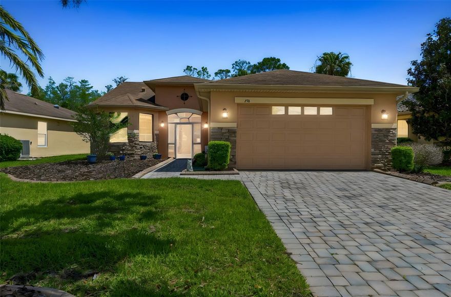 Welcome to this beautifully upgraded Sarasota model, ideally situated on a peaceful conservation lot in a quiet neighborhood just moments from the Palms Resort amenities. This meticulously maintained home offers both comfort and style with thoughtful upgrades throughout. Enjoy energy efficiency and quality with top-of-the-line Pella windows (2010) and a newer HVAC system (2018). Inside, you’ll find engineered hardwood flooring laid on the diagonal in the Great Room and Dining Room, complemented by ceramic tile in the kitchen and bathrooms, and plush carpeting in the bedrooms. Architectural details include 8-foot doors, rounded corners, and elegant 5 1/4-inch baseboards throughout. The inviting curb appeal features a screened front porch and a beautiful leaded glass front door. The kitchen is a chef’s delight, showcasing quartz countertops, 42-inch staggered upper cabinets with crown molding, pull-out drawers, stainless steel appliances, recessed lighting, and a spacious walk-in pantry. The Primary Suite is a relaxing retreat with a tray ceiling, bay window, and an en-suite bathroom featuring dual sinks, a raised vanity, and an upgraded tiled walk-in shower with seamless glass enclosure and built-in bench. Guest Bedroom #2 also features a charming bay window. Additional highlights include a laundry room with washer, dryer, and wash basin, as well as a covered and screened lanai overlooking serene conservation views—perfect for relaxing or entertaining. The extended 2-car garage provides ample space for storage and convenience. This exceptional home combines elegance, functionality, and a prime location—don’t miss your opportunity. Solivita is a premier 55+ community, offering residents an exceptional lifestyle with state-of-the-art amenities. Enjoy a fully equipped fitness center, dance and aerobics studios, and an impressive array of recreational options including 14 heated swimming pools, two heated spas, tennis courts, pickleball courts, shuffleboard, bocce ball, billiards, and an art gallery. The community also features three on-site restaurants and two championship 18-hole golf courses. With a full calendar of activities and events, there’s always something new to explore and enjoy. This home is conveniently located near a hospital and medical office complex, and shopping center.