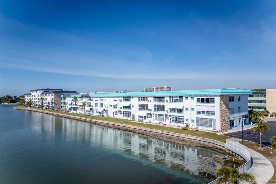 Watch sunsets over the marina and see dolphins and colorful local birds from the Florida Room windows of this second floor unit. Light & bright freshly painted with tile floors in a cool color, the unit is ready for you to move into and make into your own place, decorating in your style. This is the larger one bedroom, one bath unit at 860 square feet. It's close to the elevator and is on the same floor as the laundry room. You can use any of the four Town Shores heated pools, and spend time at the clubhouse which is equipped with a fitness room, sauna, pool tables and a small library. On the property are tennis, pickleball and bocce courts. The Groton HOA fees include gas for hot water, cooking, and heat, along with basic cable, internet, water, sewer and garbage collection. Nearby you have all the resources of charming, small-town Gulfport with its own beach, weekly market, and a long pier stretching out into the bay. The Gulfport Casino, restaurants, located on the beach, offers weekly activities including dances, fitness classes and the celebrated Gecko Ball, various shops and so much more. You are also about a 15 minute drive from Tyrone Square Mall, downtown St Petersburg, St Pete Beach, and I275 for easy access to Tampa International Airport, the Tampa Bay Rays games and Tampa Bay Buccaneers games. Carport space #26 is in the first row in front of the building.