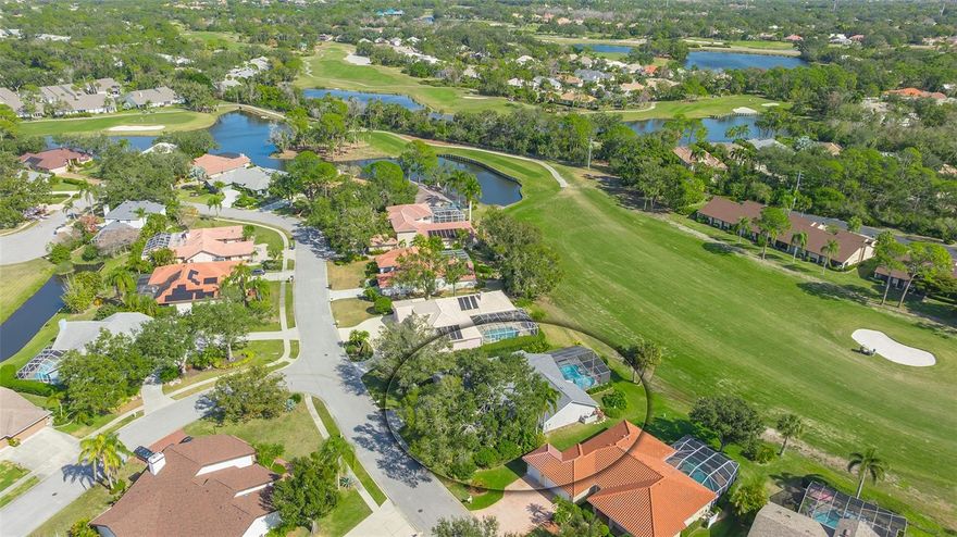 Tucked within the private enclave of Misty Oaks in Palm Air, this Don Traurig home with unique double entrance doors is a beautiful architectural creation. Set on a third of an acre with sweeping views of the 5th fairway on the redesigned lakes course of Palm Aire Country Club, this 2,656 sq. ft., three-bedroom, two baths with office/den home blends modern sophistication with serene, Florida resort-style living. This stunning home embodies Florida elegance—defined by earthy hues, layered textures, and refined finishes. The thoughtful design is evident from the moment you arrive, beginning with the unique double entrance doors, 16” porcelain tile flooring throughout, and the 15-foot vaulted ceilings. The light-filled great room is anchored by a stunning contemporary fireplace and features sliding glass doors topped with transom windows, seamlessly connecting the indoors to the outdoors. Extra large windows with upper transom windows in the dining area add to the room’s sleek, sophisticated design. Across the room the stylish custom wet bar with mounted shelving and wine glass rack are perfect for effortless entertaining. The kitchen is a showstopper with granite countertops, solid maple cabinets, and stainless steel backsplashes, stainless steel appliances, a large pantry, custom kitchen island with down draft cook-top, hidden storage, wine rack, back lit glass block design and plenty of windows looking over the pool and fairway. The kitchen dining area features sliding doors for full integration with the lanai and pool area. The primary suite is a luxurious private retreat, complete with walk-in closet, 12 ft lighted wall closet with storage above, a separate office with contemporary desk and cabinetry. The custom built and a spa-inspired bath with travertine marble tile, granite countertops, solid maple cabinets, a frameless shower door, and a sunken whirlpool tub is a relaxing oasis. Each of the two guest bedrooms includes large walk-in closets, offering privacy and comfort for family or guests. The beautifully designed second bath includes stunning custom marble countertop, vessel sink, with designer mirror. Step outside to your own private resort—an expansive screened lanai featuring covered and open-air seating and dining areas, a freeform heated pool with waterfalls and fountain. A separate inground heated spa that seats 6, all set against the tranquil backdrop of the 5th fairway. Additional highlights include a spacious laundry room with custom cabinetry, an oversized 2-car garage with golf cart bay, new roof and skylights 2022, clear Lexan Hurricane panels for all windows, Hunter Douglas Luminettes window treatments, stereo ceiling speakers in great room, primary bedroom, and lanai, extensive attic storage, built in storage in garage, and an air conditioned work room. Located in Palm Aire Community, Misty Oaks is a residential subdivision of single-family homes located in the Southeast corner of Palm Aire, with two lakes and the 5th, 6th and 7th fairways of the Palm Aire Country Club's Lake Course forming most of the perimeter. Palm Aire amenities include the private Palm Aire Country Club which offers golf, tennis, and social memberships under a variety of plans for members, pools, fitness center, tennis and pickleball courts, scenic trail. Come enjoy paradise.