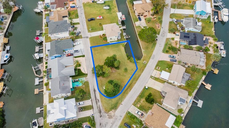 OVERSIZED, WATERFRONT LOT WITH GULF DIRECT ACCESS!! Build your DREAM home on this 0.28 acre vacant lot in Hudson Beach Estates. Corner Lot on a dead-end street with Public Water & Sewer!! Less than 5 minutes from US-19 for easy access to nearby cities, such as: New Port Richey, Tarpon Springs, Weeki Wachee, Homosassa, Spring Hill, Clearwater, and St Petersburg. Direct Gulf access with no bridges and Yvette Dr is right across the water from Hudson Beach. NO HOA!! Endless adventures await—whether you’re casting a line, soaking up the sun, searching for scallops, or taking in breathtaking sunsets. The generous lot sits on a canal, featuring 55 feet of seawall. Travel is easy with Tampa International Airport less than an hour away.