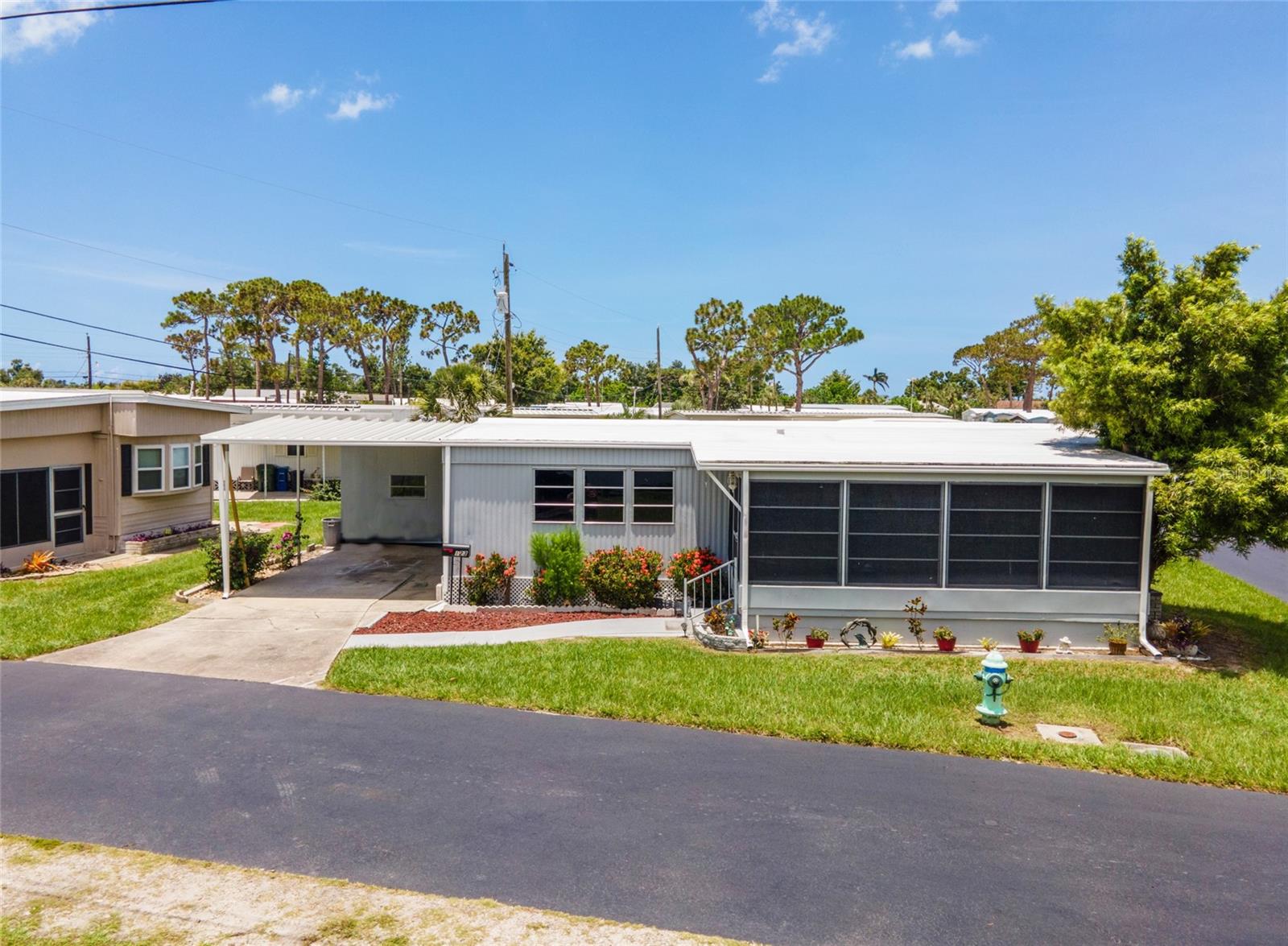This house checks all the boxes for affordable coastal living! This remodeled double-wide mobile home is on a CORNER LOT, has LUXURY VINYL PLANK FLOORING throughout, is in the 55+ community of Oak Grove with a COMMUNITY POOL and is less than 4 MILES FROM MANASOTA BEACH! Whether you're looking for the perfect seasonal escape or a full-time retreat, this charming 2 bedroom, 1.5 bath home offers unbeatable value and endless fun in the sun!
***Your primary suite is a peaceful escape with an attached half bath and THREE CLOSETS, including a walk-in. The guest bedroom features dual built-in closets and is just steps from the full bath, complete with a roomy tub and extended vanity. Outside, enjoy the shaded covered porch, ideal for grilling, unwinding with a good book, or simply soaking up the coastal breeze. Need extra storage? A utility room in the carport gives you space for tools, beach gear, and more.
~~~At Oak Grove, you are not just buying a home, you are joining a vibrant community. Spend your days lounging by the pool, playing shuffleboard, or socializing at the rec center. Explore the four pristine beaches of Manasota Key, hunt for sharks’ teeth, or enjoy the restaurants, boutiques, and events along historic Dearborn Street. You're also minutes from Venice Island, Downtown Wellen Park, world-class golf, boating, and endless Gulf Coast adventures.
***Homes in this location and price point are rare—and they go fast! Don’t miss your chance to own a piece of Florida’s Gulf Coast paradise. Call today to schedule your private showing and make your coastal living dreams a reality!