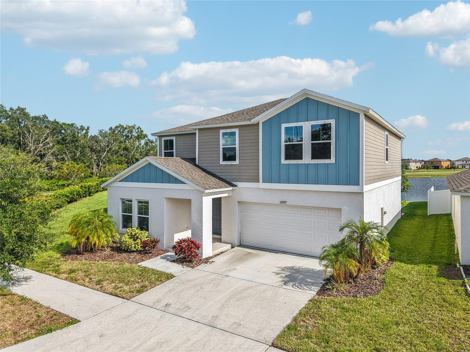 Welcome to your new home in the desirable Triple Creek community! This move-in-ready waterfront home offers a perfect blend of modern elegance and functional design. Upon entering, you're welcomed by an abundance of natural light and captivating water views that define the spacious great room. The thoughtfully crafted floor plan provides exceptional versatility, featuring a first-floor guest bedroom, a full hall bathroom, and a flexible bonus room ideal for an office, formal dining area, or any creative use you envision.
The heart of the home is the inviting great room, where the gourmet kitchen seamlessly overlooks the living and dining spaces. Framed by three large windows and a sliding glass door, the serene water views create a picturesque backdrop. The kitchen is a chef’s dream, boasting sleek quartz countertops, a generous island with seating for four, contemporary cabinetry, stainless steel appliances, and a convenient pantry. Access to the attached two-car garage is just steps away, adding to the home’s practicality.
Upstairs, a versatile bonus space awaits, perfect for a secondary living area, playroom, or private retreat. The luxurious primary suite is designed for relaxation, offering expansive water views, a spacious en suite with dual-sink vanity, shower/tub combination, and a large walk-in closet. Three additional guest bedrooms and a well-placed laundry room complete the second level, ensuring ample space and convenience. The house also comes with hurricane shutters for additional security.
Situated on a premium waterfront lot, this home enjoys a beautifully landscaped adjacent open area maintained by the association, enhancing its curb appeal and tranquility. The vibrant Triple Creek community elevates your lifestyle with access to two clubhouses, multiple pools, a splash pad, tennis and basketball courts, scenic walking and biking trails, playgrounds, fitness centers, and more.
This exceptional home combines modern comforts with an enviable location, making it a must-see opportunity.
Schedule your showing and submit your offer before it's gone!