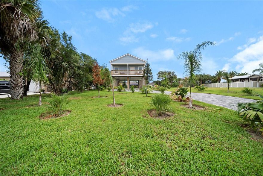 BOATER'S DREAM! Enjoy the ultimate Flagler Beachside, watersport and fishing enthusiast’s retreat. This bright, newly constructed, fully furnished stilt home on a saltwater canal just a short float away from the Intracoastal Waterway. Launch a boat or canoe right from the backyard from your private floating dock and be sure to bring your fishing gear for some of the best fishing Florida has to offer on the Intracoastal Waterway. Gamble Rogers Memorial State Park is just minutes away by boat. The Ocean just 5 blocks east for a quick bike ride or leisurely walk down the street to A1A. The famous cinnamon coquina sands of Flagler Beach are yours to enjoy in this quiet Florida Beach town which also offers trails, parks, water activities and dozens of unique eateries and shops just a short bike or golf cart ride away. Flagler Beach's down to earth, friendly community vibe makes it an ideal location for those who yearn for a relaxing, laid back, Old Florida beach town lifestyle. Need a little excitement? World famous Daytona Beach is just 30 minutes south, and historic St. Augustine is 30 minutes north. The attractions in Orlando are just 90 minutes away. This 3-bedroom, 2-bathroom stilt home offers upper-level living accessed by 2 staircases. Enjoy the canal view from the upper-level deck complete with outdoor furnishings accessed through the sliders from the living area. This home sleeps 8 comfortably. The Master Bedroom is complete with a king size bed and en-suite bath with a deck overlooking the beautifully landscaped yard with paver driveway. The 2nd guest room has a Queen bed, and the 3rd bedroom is outfitted with 2 bunk beds to sleep 4. Bring your boat, kayaks, fishing gear, bicycles and vehicles – it will all fit neatly under the residence, offering covered storage for all the toys and an outdoor shower to rinse off the sand. Located on a secluded street in the midst of all Flagler Beach and the Intracoastal Waterway has to offer, this home is fully furnished and available January 1st. All furnishings are new, high quality throughout. Kitchen: Bring your fresh catch and serve it up here with all stainless-steel appliances, loads of cabinet space and solid surface countertops with plenty of dining space adjacent and at the kitchen island. Fully stocked with all the cookware you'll need to make the most of your stay. Open living space with a large screen smart TV. Full size washer and dryer are tucked away conveniently in the hallway closet. The home has an oversized lot and features professional landscaping with full maintenance and a lovely paver driveway. You won’t have to worry about yard work. Absolutely NO SMOKING indoors, outdoors or anywhere on the property. We love animals but due to allergy concerns absolutely NO pets or animals indoors or outdoors or anywhere on the property. This is a NO PET rental. The home is located on a quiet, safe and secluded street. Guests must also be quiet and respectful. Come and plan an extended vacation or make it yours for a long term lease at this home in Flagler Beach, Florida’s East Coast's best-kept secret.