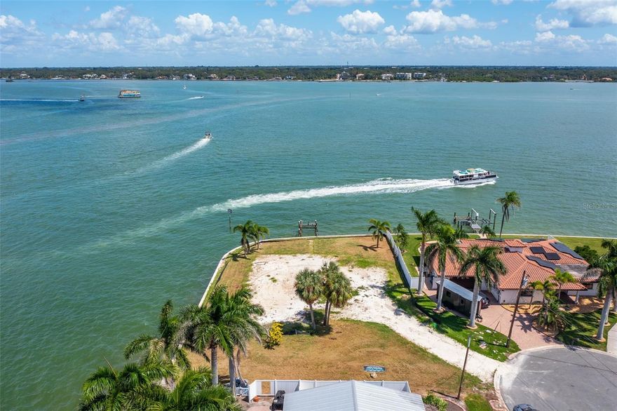 Under contract-accepting backup offers. Build Your Waterfront Dream! Rarely available, oversized lot at the end of a quiet cul-de-sac on Capri Isle, boasting over 240 feet of prime waterfront. This is your chance to create a custom home in one of the most desirable waterfront neighborhoods on Florida’s west coast.
Enjoy uninterrupted views of the Intracoastal Waterway in every direction, with easy access to the Gulf of Mexico just minutes away by boat. Watch dolphins and manatees glide by, enjoy stunning sunrises and sunsets, and take in the sights and sounds of this serene waterfront paradise. The generous lot size provides ample space for a substantial custom home, a pool, and a boat dock capable of accommodating nearly any vessel. This amazing property affords the opportunity to dock multiple vessels, including large yachts. The water depth is sufficient just a few feet from the seawall, as well as Gulf access just minutes away. Opportunities like this are rare — premier waterfront lots on Capri Isle rarely come to market and this one is EXTRA SPECIAL. Don't miss the chance to own this premier waterfront location.