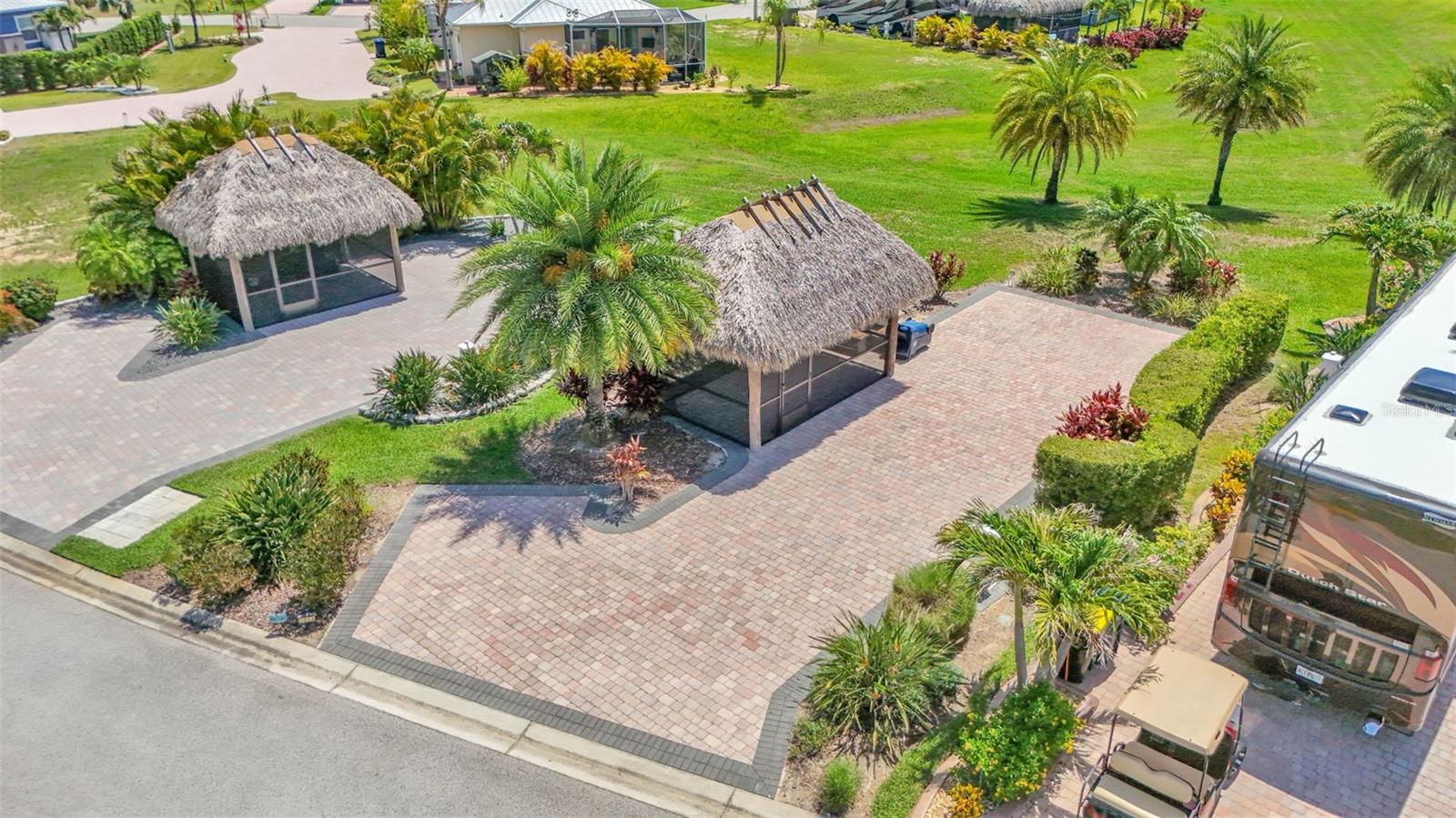 With mature landscaping, this paver pad and screened Tiki Hut is well established, ready to go and waiting for you to make it your personal paradise!
The paver pad next door can be purchased as well, and also has a Tiki Hut. If you are looking for a double lot, check out the adjacent property to the north: 2872 Wood Duck Dr. Polk City, FL 33868
This property is priced to sell!
Bay Lake Motorcoach Resort is a Class A motorcoach resort offering incredible amenities. Owners and visitors can fill their days with activities and club outings or simply relax and enjoy the resort. Whether in search of community, travel, relaxation or recreation, Bay Lake is your home base for the Florida Lifestyle.