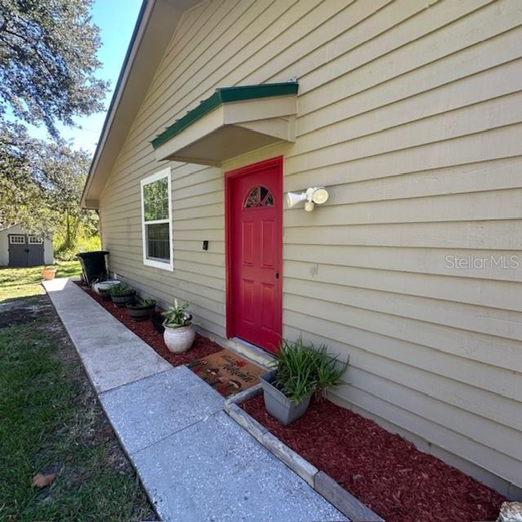 Photo of 839 Village Drive, Brooksville, FL 34601 (MLS # W7879831)