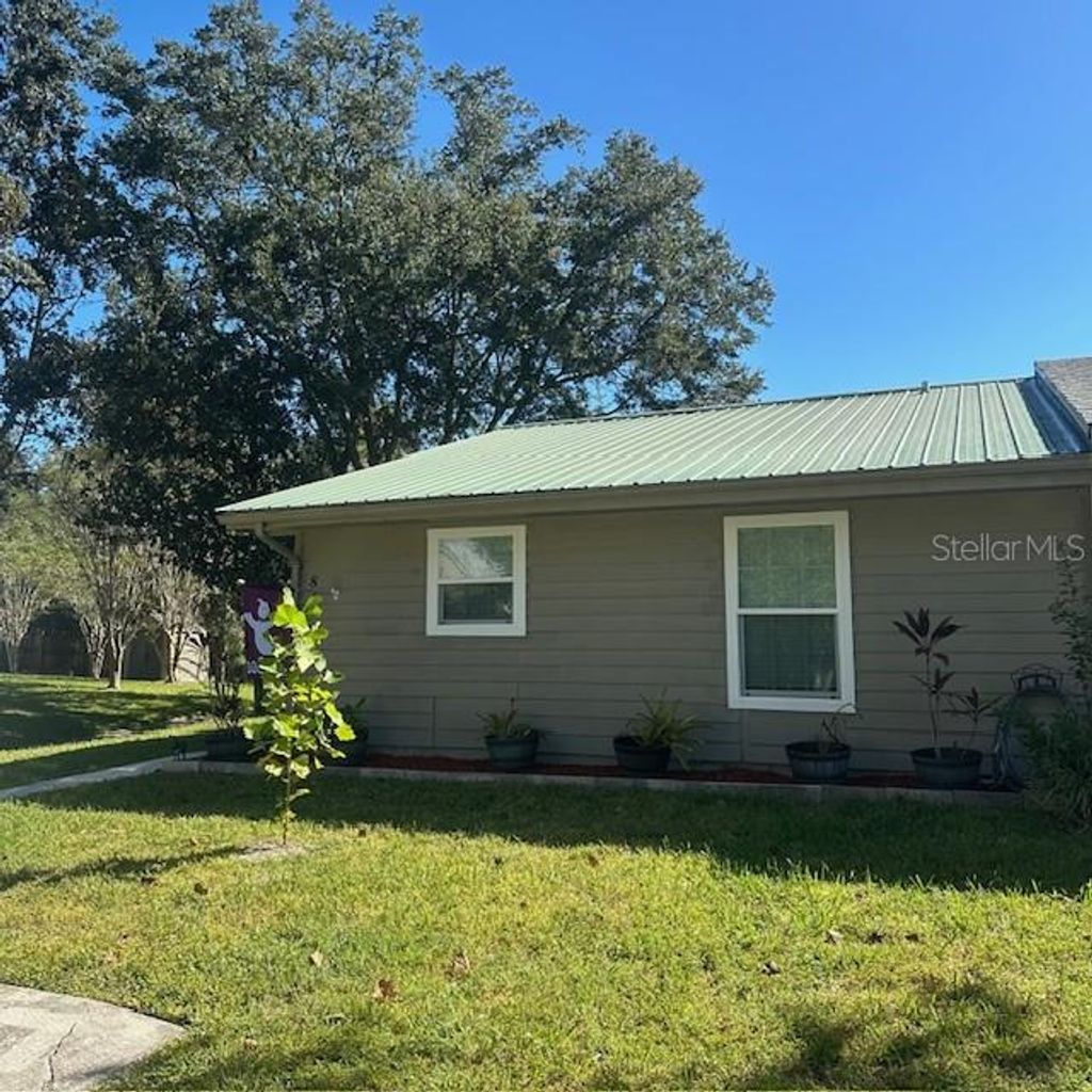 Photo of 839 Village Drive, Brooksville, FL 34601 (MLS # W7879831)