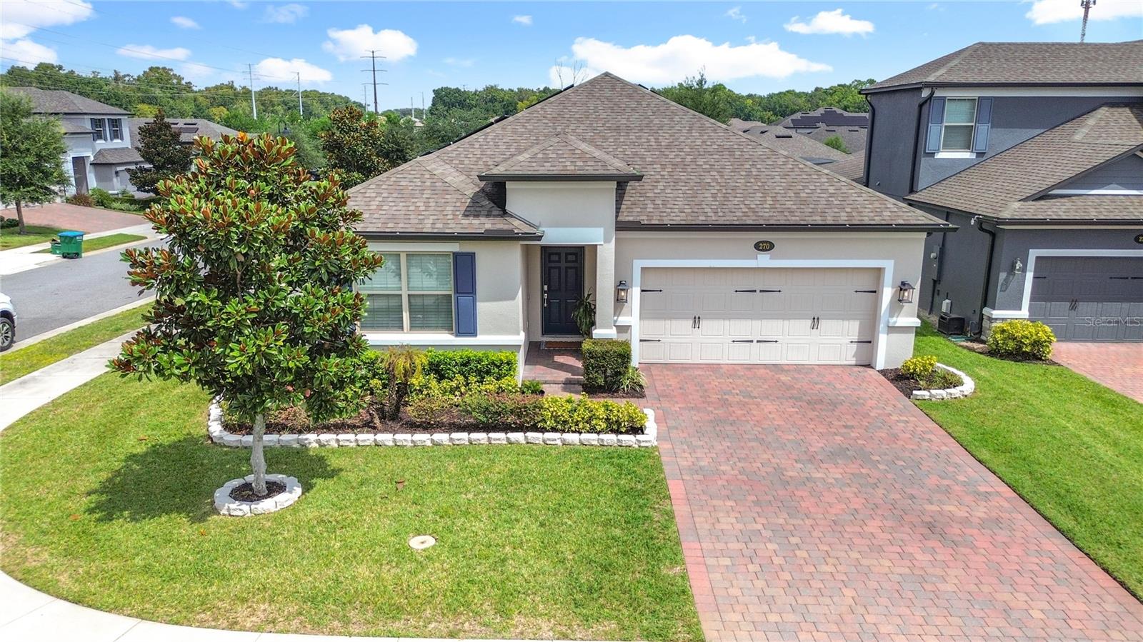 Welcome to your dream home in the highly sought-after gated community of Bay Meadow Farms in Longwood! This stunning “like new” 3-bedroom, 2-bath, 1,748 sq. ft. residence offers style, comfort, and modern living.
The spacious split floor plan is enhanced by soaring vaulted ceilings and abundant natural light, creating a bright and airy atmosphere throughout. Elegant wood-look tile plank flooring flows through the common areas, combining modern design with low-maintenance convenience.
At the heart of the home, the open-concept kitchen and great room are perfect for entertaining or everyday living. The kitchen showcases 42” light-toned cabinetry and GE® slate-finish appliances—including a French door refrigerator and slide-in range.
The luxurious owner’s suite boasts dual closets and a spa-inspired bathroom featuring a polished marble-look tiled shower that extends to the ceiling, a private water closet, and linen storage.