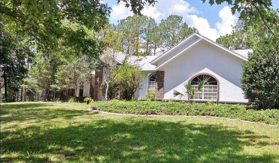 Nestled high on a private, wooded corner lot, this charming 3-bedroom, 2-bathroom residence offers the perfect blend of comfort, elegance, and open-air living across approximately 2,567 sq ft of thoughtfully designed single-story space.
Grand Entrance & Open Layout
Step inside to soaring high ceilings, a generous open floor plan, and abundant natural light that warmly greets you at every turn.
Gourmet Kitchen & Dining Nook
The spacious kitchen features oak cabinetry, dual sinks, and more—perfect for whipping up meals with ease. An adjacent breakfast nook seamlessly leads out to your private covered and screened lanai.
Outdoor Living & Pool Retreat
Entertain or simply relax in privacy with your very own inground pool, complete with an enclosed lanai and outdoor cooking area—ideal for hosting gatherings or enjoying peaceful afternoons.
Luxurious Master Suite
The master suite is a true retreat, offering French doors that open to the pool area, a cozy sitting area, a dream walk-in closet, dual "his and her" sinks, vanity space, a large garden tub, and a tiled walk-in shower.
This home is a rare find—a private, well-appointed retreat offering indoor comfort and outdoor paradise in one package. Whether you're looking for your forever home, a weekend escape, or an investment opportunity, this home delivers!