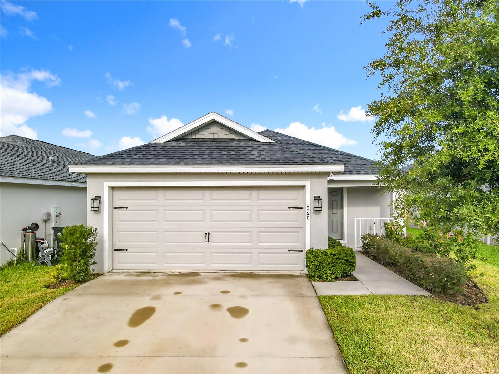 Welcome to this beautifully maintained 3BD/2BTH home w/ a 2 car garage, combining comfort, style, & modern living. The open floor plan is filled w/ natural light, creating a warm & inviting atmosphere. The spacious living & dining areas connect seamlessly to the modern kitchen, featuring granite countertops, stainless steel appliances, and a center island, perfect for everyday meals or entertaining. The private primary suite offers a true retreat with dual sinks, a walk-in closet, & a glass-enclosed shower. Additional highlights include a dedicated laundry room, & window blinds throughout, & a screened porch to entertain guests Ideally located in Davenport, this home offers easy access to shopping, dining, schools, & major highways, making it an excellent choice for both everyday living & entertaining.
