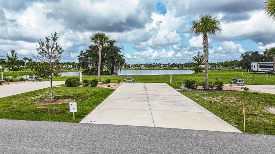 Lot 194 at Resort at Canopy Oaks offers water views and privacy in the rear of the resort, just a short bike or golf cart ride from all amenities. Features include an upgraded paver patio with fire pit, a 20’ x 70’ concrete pad with full 20/30/50 amp hookups, and space for Class A & C motorhomes, fifth wheels, travel trailers, or a small park model — perfect for a seasonal or year-round retreat.
Resort amenities include a tiki bar with live music, pool and spa, putting green, pickleball courts, and beautifully maintained grounds. Use it as a personal getaway or enroll in the resort-managed rental program for potential income. Centrally located in Florida with easy access to fishing, theme parks, shopping, dining, and more.
**Developer incentives are currently available, adding even more appeal to this remarkable opportunity.**

**Developer incentives are currently available, adding even more appeal to this remarkable opportunity.**