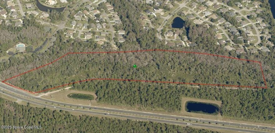 This 30.46-acre parcel on Old Tomoka Road offers an exceptional development opportunity within the prestigious Hunter's Ridge DRI. With approximately 15.56 acres of uplands and the serene Little Tomoka River running through the property. This site is perfect for a residential development with DRI approvals for up to 50 units, making it ideal for apartments, condos, or townhomes. Zoned for both residential and commercial use, this versatile property provides endless possibilities for developers. Utilities are readily available, with a water main at Shadow Crossing and sewer access at Valencia. The parcel boasts a prime location just 3 miles from I-95, ensuring easy access for future residents or businesses, and benefits from an average of 13,000 vehicles daily, providing excellent visibility. Surrounded by natural beauty and located in a rapidly growing area, this property is priced to sell fast, making it a must-see for investors and developers alike. Seller has plans for a 38 unit townhome development that can be delivered engineered/ permit ready for an additional cost or the buyer can take over approvals.