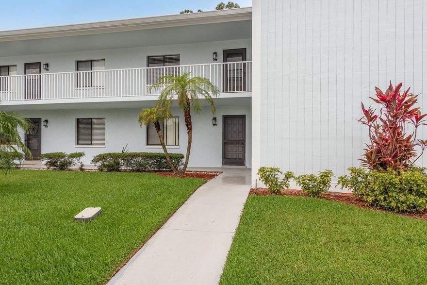 Welcome to this charming 2-bedroom, 2-bathroom condo in the highly sought-after gated community of East Lake Woodlands. Featuring a new A/C system (2022) and located just across from the community pool, this unit offers the perfect blend of comfort and convenience. The open split floorplan provides plenty of space for both relaxing and entertaining. The living room boasts a wood-burning fireplace and sliding glass doors that lead to a screened-in balcony overlooking a peaceful pond and mature trees—the perfect spot to unwind and enjoy the Florida breeze. The kitchen is outfitted with stainless steel appliances including a refrigerator, dishwasher, and microwave, along with a separate pantry for added storage. The spacious primary suite features three walk-in closets and an en-suite bath with an updated vanity and tiled walk-in shower. The second bedroom is conveniently located near the guest bathroom, also featuring modern finishes. Additional highlights include a full-sized washer and dryer, ample in-unit storage, and assigned carport parking. The monthly condo fee includes cable, trash, sewer, water, and more! Enjoy a prime location across from the AMC Woodlands movie theater, a shopping center with a variety of restaurants, and just minutes to more shopping, dining options, and a short drive to the beautiful Gulf beaches. Whether you're seeking a full-time residence, a seasonal retreat, or a smart investment, this move-in-ready condo has it all!