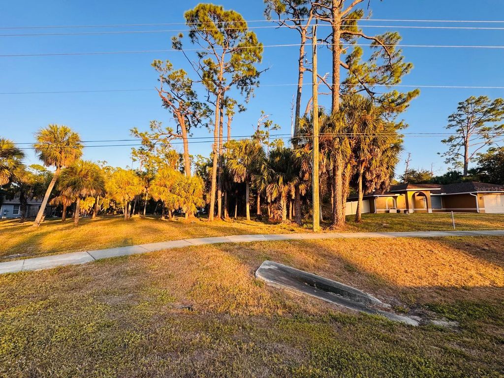 Photo of 16938 Toledo Blade Boulevard, Port Charlotte, FL 33954 (MLS # TB8456309)