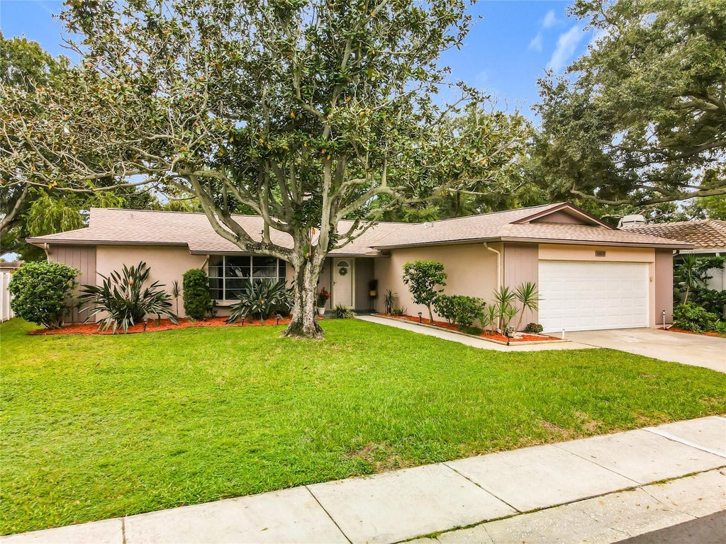 Photo of 10617 Seminole Forest Street E, Seminole, FL 33778 (MLS # O6447634)