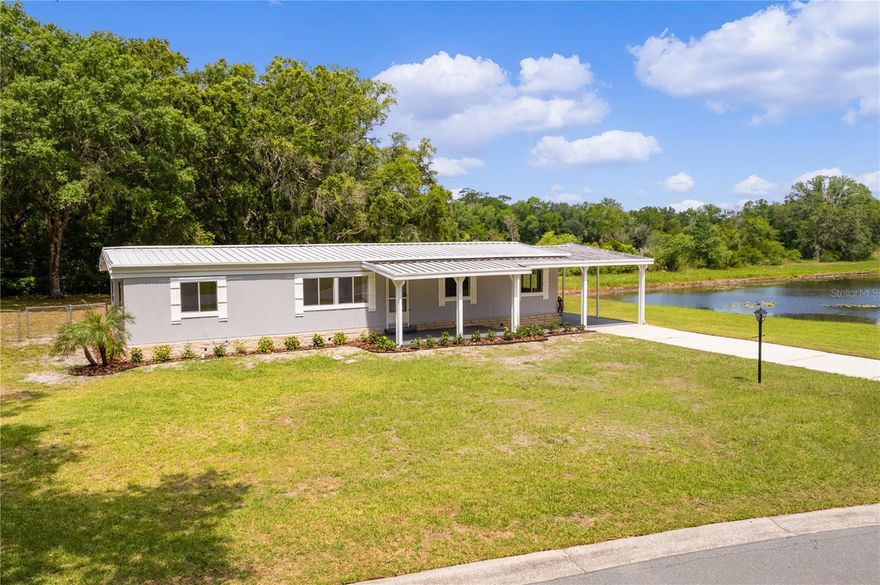 Waterfront Home: Move-In Ready. 

Discover this 3-bedroom, 2-bathroom home situated on a serene 1/3-acre waterfront lot. Perfect for the avid angler, you can enjoy fishing right from your side yard and unwind in the evenings in your freshly renovated home. Located conveniently close to essential amenities without the burden of high HOA or amenity fees.

Interior Features:

Newly Painted: Both the interior and exterior have been recently painted, giving the home a fresh, inviting look.
Updated Landscaping: Professionally redesigned landscaping enhances the curb appeal.
Newly Painted Concrete: Adds a beautiful finishing touch to the exterior.
Laminate Flooring: Durable laminate flooring throughout creates a warm and welcoming atmosphere.
Exterior Features:

Private Fenced Backyard: Ideal for visiting grandchildren, pets, or entertaining guests.
Carport: Spacious enough to accommodate two vehicles.
Screened Lanai: Enjoy the outdoors year-round with a 20x10 ft covered and screened lanai, complete with an attached utility room and a removable handicap ramp.
Community and Additional Benefits:

Flexible HOA: Allows for an attached storage building and parking for boats or RVs in the rear of the home.
Privacy: The irregularly shaped lot offers unparalleled privacy at the front, back, and sides of the property.
Year-Round Sunshine: Enjoy Florida’s great weather without the hassle of snow.
This home is competitively priced to sell and represents the best value in the neighborhood. Don’t miss out on this incredible opportunity!

Contact us today to schedule a viewing and make this waterfront dream home yours.