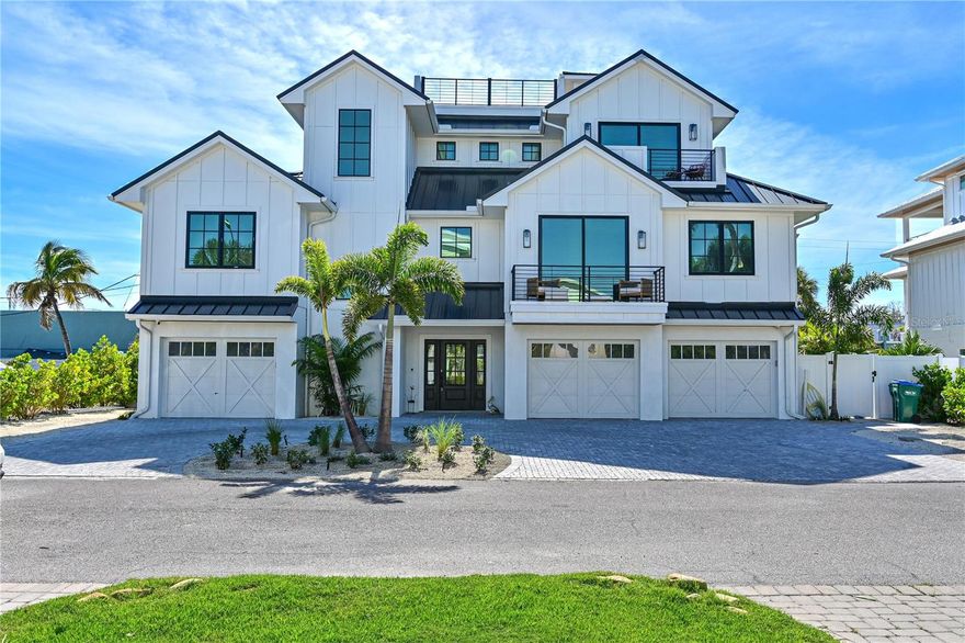 Welcome to "Black Pearl"! Discover refined island living in this exceptional 2024 custom-built residence, ideally situated just 1.5 blocks from the pristine Gulf beaches. Designed with sophistication and comfort in mind, this 4-bedroom, 4-bath elevated home offers a seamless blend of modern elegance and coastal charm. The light-filled great room showcases designer furnishings, premium finishes, and expansive living and dining spaces. The gourmet kitchen is a true showpiece, featuring quartz countertops, custom wood cabinetry, Dacor high end appliances, large island and wet bar with ice maker just off the dining room. Four spacious bedrooms and bathrooms provide privacy and luxury for residents and guests alike. An elevator services every level from the outside pool area all the way up to the roof top deck complete with firepit, enhancing ease of living. Step outside to your private resort-style sanctuary complete with a heated pool, spa, and lush tropical landscaping with turf. Multiple covered balconies and outdoor living areas create inviting spaces for relaxation or elevated entertaining. Offered fully furnished, this residence embodies turnkey luxury on Anna Maria Island. A rare opportunity to own a newly constructed coastal retreat in one of Holmes Beach’s most desirable locations on a dead end street. The home is barely lived in and is just being started as a weekly rental the end of November which will become a superb investment property or make it your very own. Do not miss out on this amazing property! Schedule your showing today!