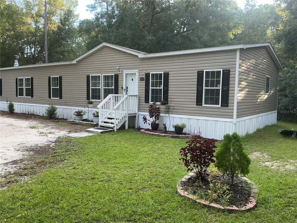 Photo of 4050 SW 178th Terrace, Dunnellon, FL 34432 (MLS # OM730486)