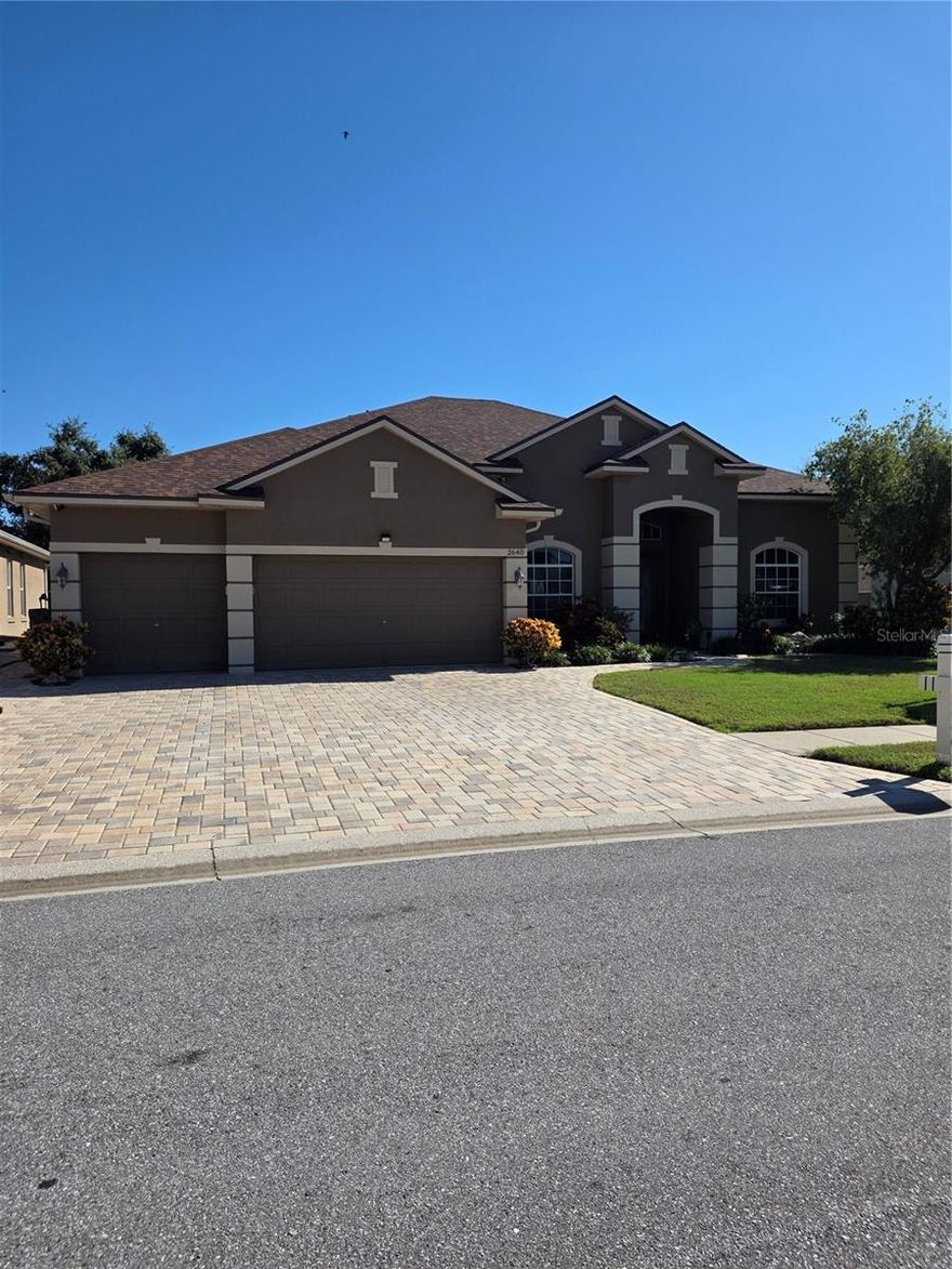 This home is also listed for Sale. Welcome to this stunning, meticulously maintained 1-story home with a spacious upstairs bonus room, located in the highly desirable gated community of Key Vista. Sitting approx. 15 ft. above sea level, No Flood Ins. Required! Just minutes from the Gulf beaches, Anclote River Park, and the brand-new Coastal Anclote Trail, this home offers the perfect blend of comfort and luxury. Owner financing available w/ 30% down. Homeowners Ins. Only $1,689 yearly. This residence features a roof less than 2 yrs old, 4 bedrooms, 3 full bathrooms, 3-car garage, a private office (5th bedroom w/ closet), and a large second-floor bonus room with walk-in closet—ideal as a 6th bedroom, game room, theater, or man cave. Enter through grand 8-ft. glass double doors to a mosaic tile inlay, custom chandelier, and elegant recessed ceilings with wood inlay. The open-concept floor plan highlights a gourmet kitchen overlooking the living room, perfect for entertaining. The kitchen features granite countertops, stylish backsplash, 42-inch wood (gray) cabinets w/ crown molding, stainless steel appliances, pendant lighting, and LED fixtures throughout. Floors include 18-inch tile in main areas, new laminate in bedrooms, and tile in the master. The primary suite is a peaceful retreat with tray ceilings, crown molding, and a fully remodeled with seamless glass shower, floor-to-ceiling tile, soaking tub, and granite-topped wood cabinetry. Both secondary baths have also been remodeled with the same attention to quality and detail. Additional highlights: 5 ¼-inch baseboards, crown molding in primary living areas, wood-look tile in the office, custom trim, and two A/C systems with germicidal UV lights. Outdoor living shines with over 2,500 sq. ft. of pavers extending from driveway to side yard and back patio. The extended patio has footers ready for a screened enclosure or gazebo. Enjoy the fully equipped outdoor kitchen with grill & fridge, or relax by the custom fire pit. The backyard offers rare privacy with no rear neighbors, overlooking a peaceful open field, and is a short walk to the clubhouse and heated pool. The upstairs bonus room, currently used as a game room, includes a built-in bar, chair rail, wood-look tile, and crown molding—providing versatile flex space. Other upgrades include a widened driveway and concrete curbing throughout the landscaping. Key Vista is an amenity-rich, vibrant community with a clubhouse, heated pool & spa, fitness center, tennis and volleyball courts, playground, and access to nearby nature trails and the Holiday Recreation Center. Just outside the back gate lies the intracoastal waterway leading to the Gulf of Mexico—perfect for outdoor lovers and boaters.