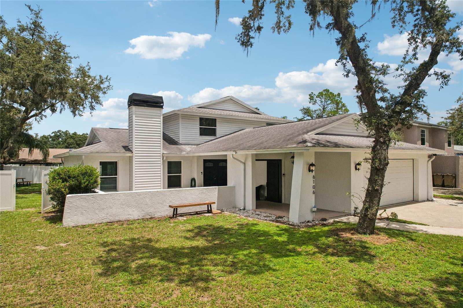 * NO HOA * 2-Primary Suites* (1 up 1 down) Modern Upgrades, NEW ROOF (2020), Backyard Oasis, and Space for Everyone. This Multi- Generational Home or a potential Short Term Rental Money making investment tucked away on a peaceful cul-de-sac in a lovely neighborhood, this beautifully updated home offers some great modern style and room to spread out. With 5 bedrooms, 3 full baths, and a handy half-bath downstairs, it’s the kind of place where everyone can have their own space—and still gather easily in the open, welcoming main living areas. Step into the heart of the home: the remodeled kitchen with sleek European-style cabinets, quartz countertops, and an oversized island with a deep sink that’s perfect for cooking. Stainless steel appliances include a Bosch dishwasher, Whirlpool smart double oven, cooktop, and range hood, plus a roomy LG fridge. The living space flows right into a sunny backyard that feels like your own private retreat. The resurfaced pool and spa feature LED lights, fresh tiling, and a newer heater, all enclosed by a screened-in cage. Whether you're unwinding solo or entertaining a crowd, it’s all ready to go. Inside, thoughtful updates like impact windows, newer French doors, European oak stairs, and built-in ceiling speakers with multi-zone control add modern touches throughout. The primary bathroom has been freshly remodeled, along with other updates like a new water heater, electric sub-panel, and EV charger in the double garage. Close to major highways, I-75, I-4, and I-275, and close proximity to USF and the up-and-coming Uptown Tampa area. With a newer roof (2020) and recent tree trimming, this home is move-in ready and made to enjoy—indoors and out.