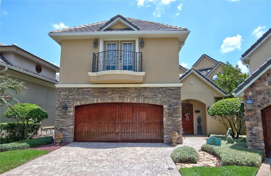 Experience old-world elegance and modern luxury in this stunning European-style villa located directly on the golf course. From the moment you arrive, a dramatic gated courtyard entrance welcomes you with a cozy outdoor fireplace and tranquil Koi pond with cascading waterfall—setting the tone for the unique charm and sophistication found throughout this extraordinary home. Just before entering the main house, discover a detached second-floor guest suite with its own private entrance—ideal for an In-law suite, studio, or private home office. Inside, the thoughtfully designed main home features a versatile downstairs bedroom (or office) with an integrated SAFE room, built with cement-filled cinder blocks and a concrete ceiling for added peace of mind. The formal dining room flows seamlessly into a warm and inviting living space with a gas fireplace and a chef’s kitchen equipped with a 5-burner Dacor gas range, granite counters, center island, two-drawer dishwasher, Amana refrigerator, walk-in pantry, and a wine/wet bar—perfect for entertaining. Upstairs, accessible by staircase or private elevator, the luxurious primary suite offers a serene sitting area, a spa-inspired bathroom with soaking tub and separate shower, and a custom walk-in closet with built-in vanity. Wake up to panoramic golf course views and step out onto the private balcony to enjoy your morning coffee. Two additional bedrooms and a full bath complete the upstairs layout. Additional highlights include: Travertine floors throughout, Walk-in attic with interior access and superior insulation for energy efficiency, generator, covered patio with built-in Ducane gas grill and direct golf course views and located just steps away from the Heathrow Country Club. Lawn care included by HOA for worry-free maintenance. This home offers timeless beauty, energy-smart features, and uncompromising security in a sought-after golf course community. If you’re looking for the best of everything, this villa is it.