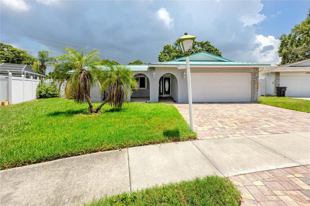 Photo of 12291 Monarch Circle, Seminole, FL 33772 (MLS # TB8534597)