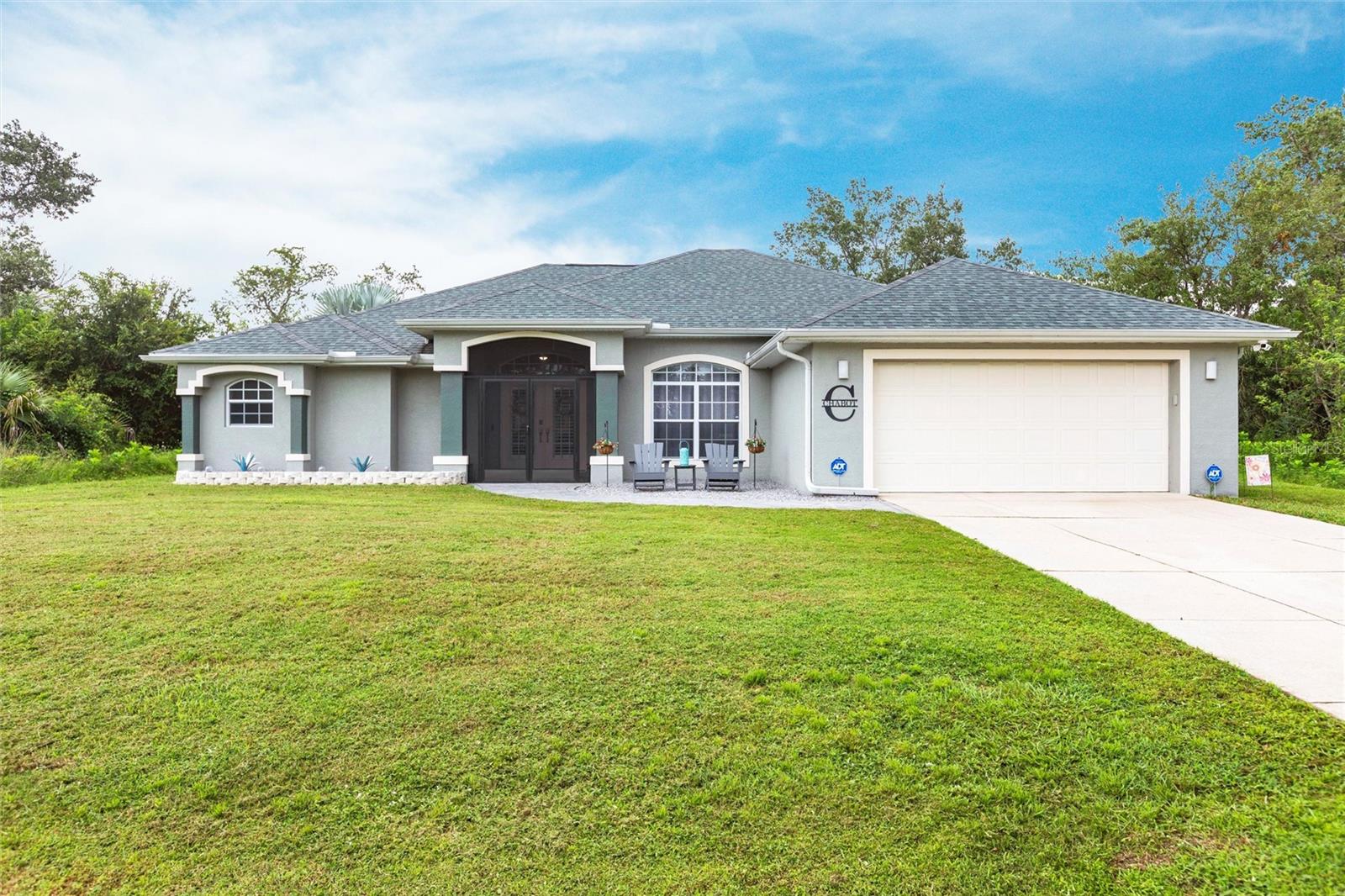 Nestled on a spacious wooded lot along a freshwater canal, this beautifully maintained single-family pool home offers 1,960 sq. ft. of living space with 3 bedrooms plus a versatile flex room, 2 bathrooms, and an attached 2-car garage—perfect for families seeking both comfort and functionality. From the moment you arrive, this home makes a lasting impression. A long driveway leads to the attached two-car garage, while the neatly landscaped front yard provides a welcoming touch. The inviting screened double-door entry is framed by arched windows and architectural details that add character to the façade. A charming front sitting area creates the perfect spot to relax with morning coffee or greet guests, setting the tone for the warmth and comfort that continues inside. Inside, the open living area is highlighted by soaring ceilings, Porcelain Plank Tile floors throughout (except office), and a cozy electric fireplace. Zero corner sliding glass doors lead seamlessly to the pool and lanai, creating the ideal indoor-outdoor flow for entertaining or relaxing by the water. The heart of the home, this beautiful kitchen, blends style and functionality. Featuring sleek stainless-steel appliances, abundant cabinetry, and a striking tile backsplash, it offers plenty of storage and workspace for any home chef. The expansive leathered granite, center island with sink and breakfast bar seating is perfect for casual dining or entertaining, while the open layout connects seamlessly to the main living area. Modern finishes, high ceilings and recessed lighting complete the bright, inviting atmosphere. Overlooking the family room with its attached dining area, this open-concept design creates a seamless flow, ideal for gatherings both large and small. The spa-inspired primary bathroom offers both luxury and functionality. Designed with dual vanities and expansive mirrors, it provides ample space for two. A beautifully tiled Roman shower with arched window detail creates a light-filled retreat, while neutral tones and modern finishes add to the serene, sophisticated feel. Two additional bedrooms with built-in closets provide plenty of space for family or guests, while a flex room without a closet offers endless possibilities—home office, playroom, guest room, or hobby space. A full guest bath with tub/shower combination is conveniently located. Enjoy resort-style living in your own backyard with this heated pool with decorated poolside decking overlooking the waterway. Surrounded by a spacious screened lanai, the pool area offers plenty of room for lounging, dining, and entertaining. A covered seating area with ceiling fans ensures year-round comfort, while the lush greenery and canal views provide a private and peaceful backdrop along with great fishing. Whether swimming, relaxing, or hosting gatherings, this outdoor oasis is the perfect extension of the home. Additional highlights include plantation shutters on front doors, reverse osmosis, security system, oversized closets, a laundry room with utility sink and extra storage, new roof in 2022, hot water heater 2016. Centrally located near I-75, US-41, shopping, dining, golf, beaches, and more, this property is move-in ready and designed for both indoor comfort and outdoor enjoyment. **PLEASE ENJOY THE 3D INTERACTIVE VIRTUAL TOUR ASSOCIATED WITH THIS LISTING**