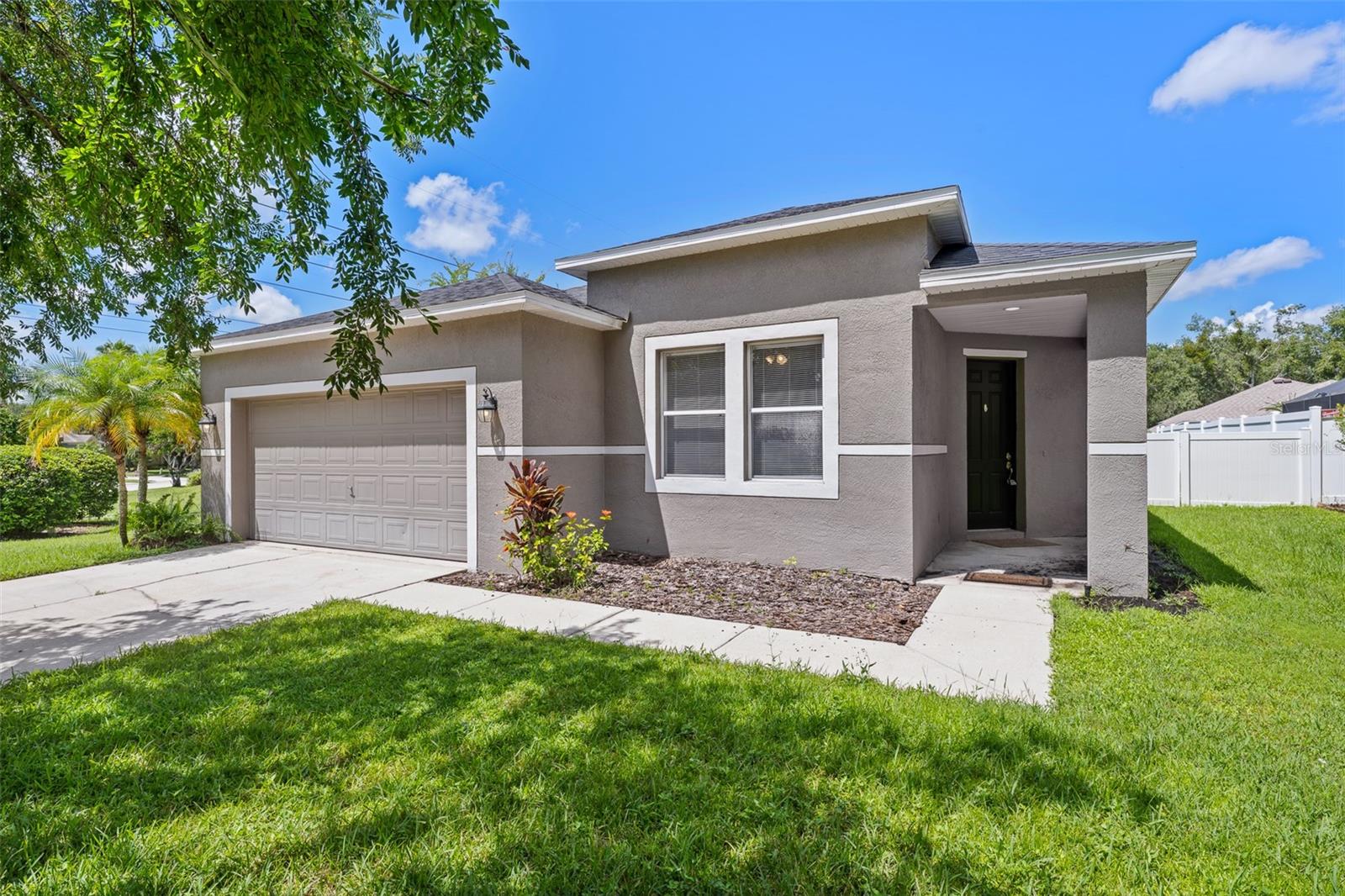 Beautiful home in the FishHawk Ranch community. This three bedroom, two bath home is located in Phase 1 of the FishHawk Ranch community. The roof was installed in 2021. This home features an updated kitchen including a dishwasher and natural gas stove. Granite countertops and a glass subway tile back-splash highlight this very large and bright kitchen with lots of cabinet space, and a pantry. The kitchen has a huge island that is completely open to the family room allowing for plenty of entertaining space. There is laminate flooring, carpeting, and ceramic tile throughout the home. The exterior is painted an attractive color. The spacious primary bedroom features an en suite with double vanities, a walk-in shower, and a large walk-in closet. The FishHawk Ranch community features A-rated schools, miles and miles of nature walking, hiking, and biking trails, resort-style aquatic club, multiple pools, splash pads, multiple fitness centers, tennis courts, playgrounds, pickleball, and much, much more. With picturesque views throughout and zone for the A-Rated FishHawk Creek Elementary, Randall Middle and Newsome High School make it a wonderful place to live. This home is next to one of the paths (no neighbor to the left) and is only a short walk to the tennis/basketball/softball complex and a private FishHawk pool and fitness center located in Phase 1.