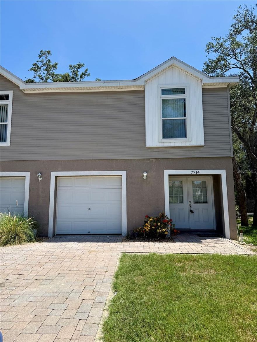 Come explore this 3-bedroom, 2-bathroom end unit, designed with a split bedroom layout for privacy. The open living concept provides a spacious area for furniture placement. Trey ceiling in the living room and dining area just off entry. Ample storage space with walk in closet and ensuite bathroom. This home features an oversized two-car garage with ample storage space. Enjoy the serene beauty of the wooded backyard from the beautiful upper and lower decks, perfect for listening to the local wildlife. Take advantage of the stunning community pool and jacuzzi tub for relaxation and leisure. Conveniently located near beaches, sponge docks, shopping, US 19, and much more. Don't miss out on this incredible opportunity! Please note, a $150 administrative fee is due prior to move-in.