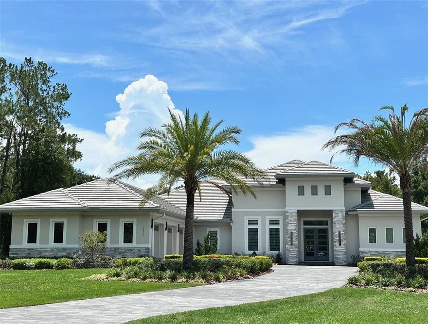 Located in the guard gated golf community of Bella Collina, this single-story custom home is one of kind and move-in ready. Positioned on a private one-way street with no front or rear neighbors, this home offers a SW facing backyard on a 1.3 acre preserve site. The open floor plan greets you with high ceilings and 10 ft sliding pocket doors that lead seamlessly to the expansive lanai, outdoor kitchen, and pool deck. Remote-controlled screen enclosures enhance the outdoor living and entertaining experience. A chef’s kitchen with Sub-Zero built-in wall oven and microwave, 5 burner gas range with plenty of countertop space and custom cabinetry overlook the great room. Large porcelain tiles throughout the home provide for low maintenance and a continuous flow from room to room. Natural earth tones throughout, provide a calm home ambiance. The spacious master suite offers his and hers walk-in closets, an ensuite bathroom with double vanities and large walk-in shower with built in benches and separate soaking tub. The guest suite is perfect for in-laws or visiting guests with its own patio and side entrance. The large home office and yoga room can easily be converted to a game room or additional bedrooms. The 3-car upgraded garage offers built in custom workstations, storage and mini split AC. All furnishings are available for purchase. Enjoy a round of Golf on the Nick Faldo designed 18-hole championship golf course or wind down with a Soothing massage at the Spa. The Club at Bella Collina amenities include Har Tru tennis courts, outdoor pool complex, pickleball, fitness center, free fitness classes along with year-round social and culinary events for the entire family. Call today to set your private preview appointment. Bedroom Closet Type: Walk-in Closet (Primary Bedroom).