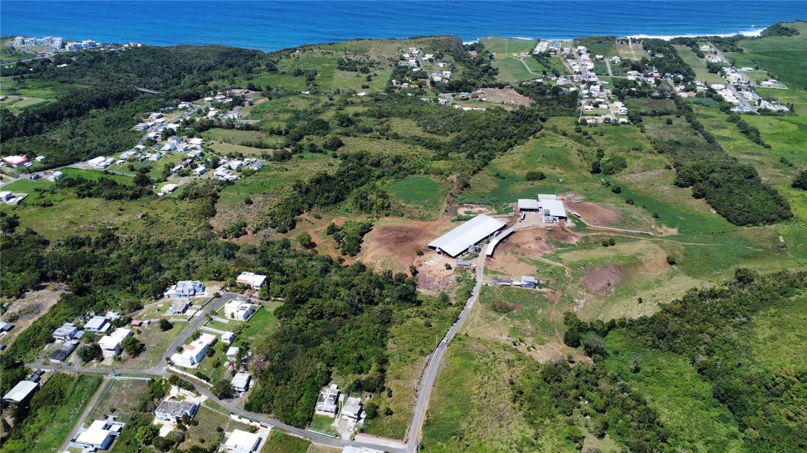 THE SUBJECT PROPERTY IS LOCATED INTERIOR OF PR-2 IN THE YEGUADA WARD OF THE MUNICIPALITY OF CAMUY, PUERTO RICO. THE PROPERTY IS MADE UP OF 4 ADJOINED LOTS WHICH PROVIDE 66.4 "CUERDAS" OF USABLE LAND. THE PROPERTY HAS A 180 DEGREE VIEW OF THE ATLANTIC OCEAN.