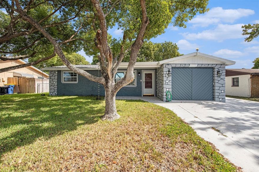 Location, Location! A Gem in Embassy Hills. This cherished residence, held in the same family since 1994, welcomes you with open arms. A symphony of care and devotion graces every inch of this property. The curb appeal and stone-like accents are proof of its unique character.

This home has undergone a complete transformation, happily awaiting its new owner. With a less-than-three-years-old AC unit, freshly painted, brand-new appliances and a keyless smart entry, this house is designed to make life more comfortable and secure. For added peace of mind, the generator is included!

Step inside, and you're greeted by the open concept living area that invites you to create a lifetime of memories with your loved ones. The chair rails gracefully guide you throughout the house, and the freshly laid tiles with the unique design exude style and elegance. The kitchen is a masterpiece of open-concept design, ideal for hosting cherished family gatherings. One truly distinctive feature is the three-car driveway, a rare find in this area!

Outside, a spacious fenced backyard stands ready to be your canvas for relaxation and recreation. Imagine the possibilities of a serene garden, a delightful entertainment area, or your very own oasis. Gutters and downspouts, an irrigation system, as well as fenced yard, complete the picture of this splendid property.

For added peace of mind, this property is NOT in a flood zone!!

Make it your first home, your ultimate retreat, or your go-to vacation haven. Situated in close proximity to Gulfview Mall and US 19, you'll find restaurants and shopping at your fingertips. The glistening beaches and nearby boat ramps leading to the Gulf offer opportunities for great fishing, beachcombing, and island exploration along our enchanting coastline. This home embodies the very essence of Florida living, where every day feels like a vacation. Don't miss this opportunity to call it yours.