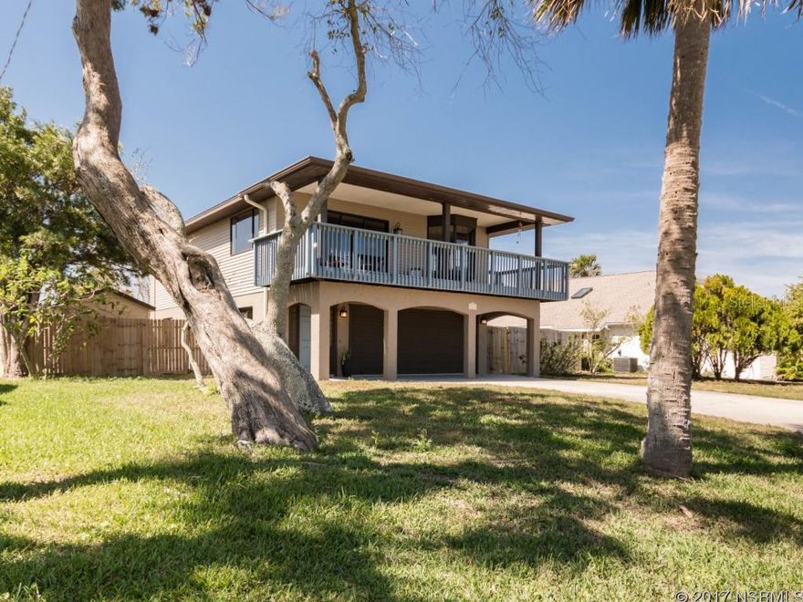 Gorgeous remodeled home just blocks from the no-drive beach - turnkey and move-in ready, and wait 'till you see the spacious 2nd floor balcony where you'll relax with coffee at sunrise and evening beverages and ocean breezes for moonrises. The upstairs features stunning oak wood floors in the large open living space and a fantastic kitchen with granite counter tops, beautiful cabinets, stainless steel appliances, and an island. And wait till you see the master suite and master bathroom - very, very nicely done with class, style and quality. There is also a convenient half bath/laundry room upstairs. Downstairs are two guest bedrooms, a remodeled bathroom and extra-deep 2-car garage. (The seller says you'll fall in love with the whole-house central vacuum system, too!) The side and back yards have a privacy fence; the metal roof is barely 2 years old. Two public boat ramps are within blocks of the house; nearby beach has crosswalk at Atlantic Ave and a public fire pit. This home is fantastic, shows like new - and is near the beach! ;Water: City