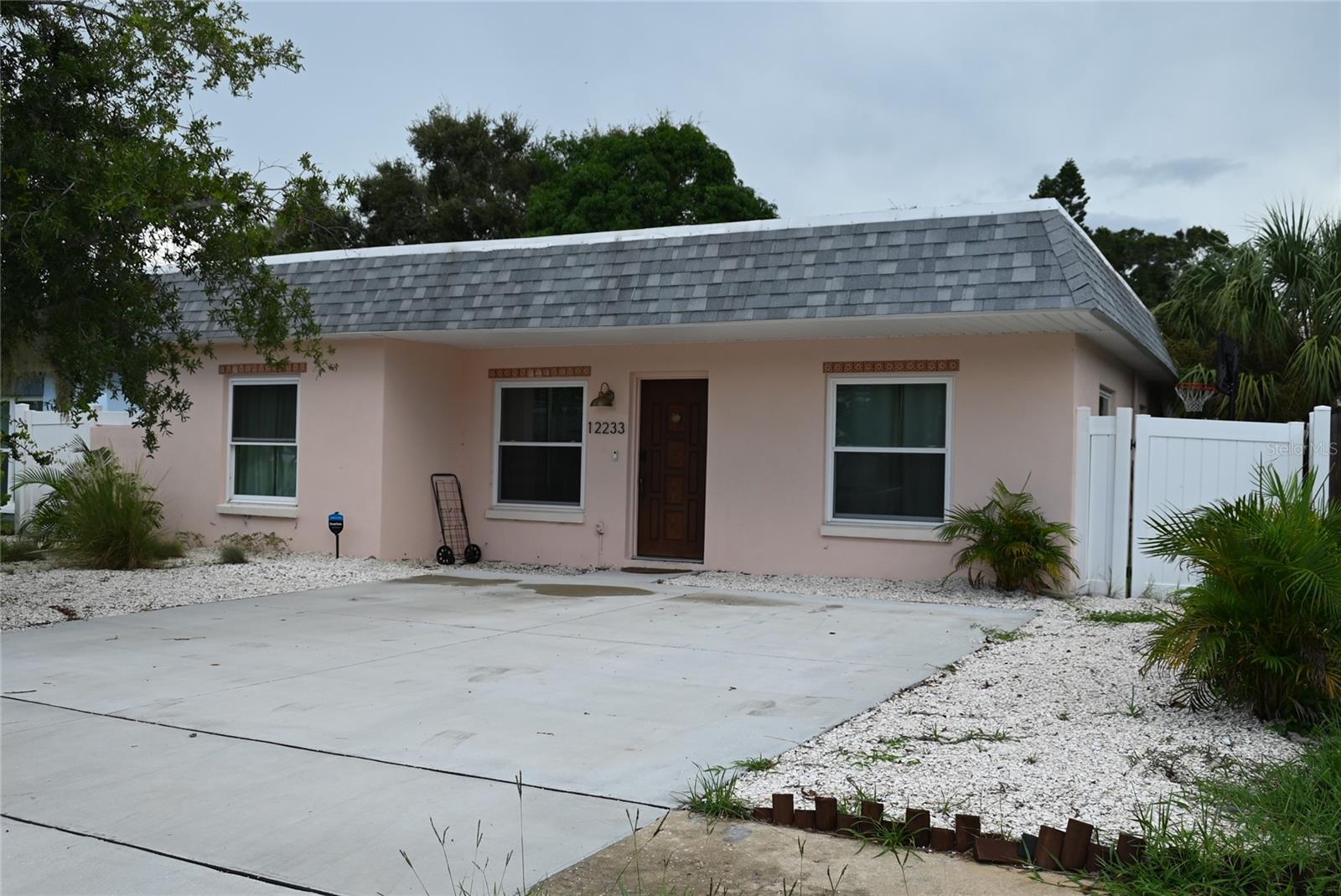 Check out this 3 bedroom, 2 bath home in Largo just minutes from Indian Rocks Beach. Updated throughout with laminate and tile floors. Completely open kitchen area with dedicated dining room as well. Backyard has low maintenance plantings and a raised sun deck and separate fire pit. Inside laundry. Owners are looking for long term tenants so furniture will be removed. Shopping is just a block away. No HOA community.