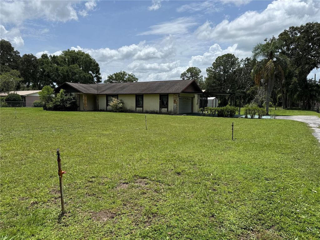 Photo of 5407 W Knights Griffin Road, Plant City, FL 33565 (MLS # TB8407561)