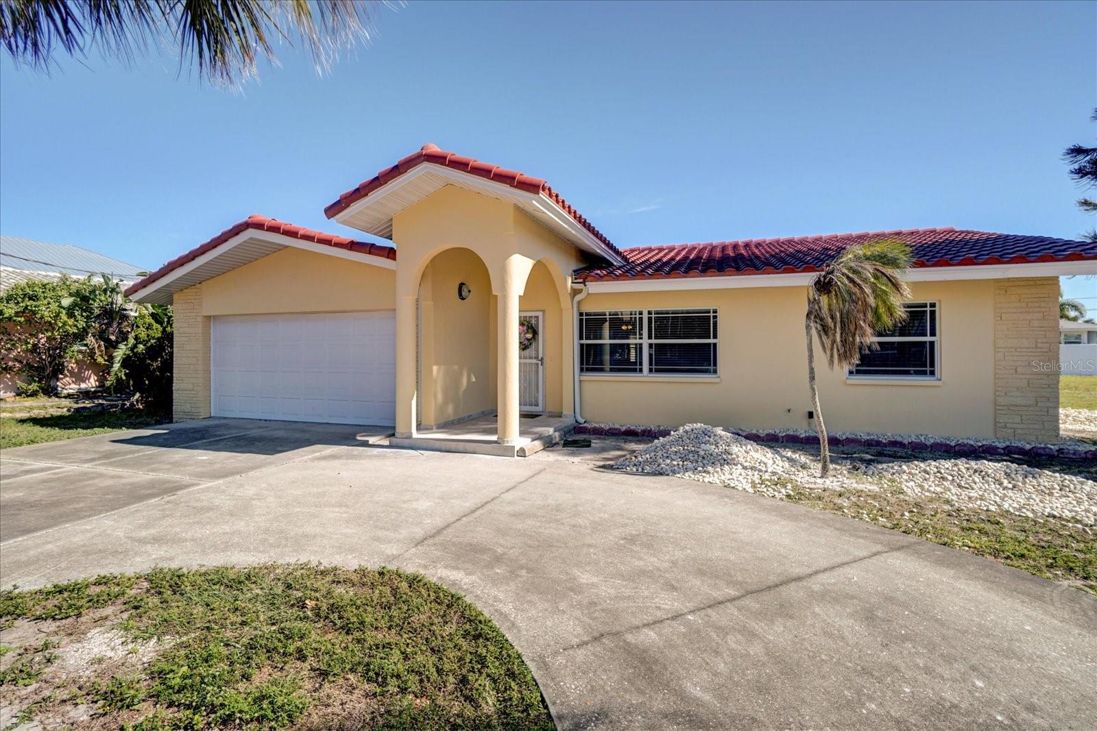 Spacious 3 bedrooms, 2 baths with 2 car garage single family home, adjacent to large lot provides a spectacular opportunity to reside in Belleair Beach with plenty of outdoor space to enjoy the gulf breezes & glorious sunsets. (Owner provides lawn care). Oversized master bath features a walk-in shower with separate jetted bathtub perfect for 2. The Belleair Beach community has a resident only beach parking, nearby tennis courts at the city of Belleair Beach location (near Belleair Causeway bridge), Intracoastal waterway with playground is a short walk away & sandy areas perfect for fishing or launching kayak/paddle board. Residents also have access to community boat ramp & marina located 0.3 mi away. Steps away, is direct gulf access via Morgan Park Beach; complete with restrooms, bike rack, outdoor sand rinse-off showers, covered picnic pavilion & BBQ grills. Close to Sand Key which also features dining, shopping, salons, & more! Enjoy glorious sunsets over the Gulf & embrace the beautiful beach life this location has to offer.