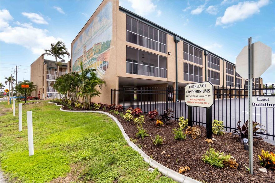 Prime Location in Downtown, Historic Punta Gorda, just steps away from Charlotte Harbor. This 55+ Community offers resort style living right outside your front door. Located on the Harbor Walk, which is a 2.5 mile path running along Charlotte Harbor and connects Laishley and Gilchrest Parks, as well as providing a path to Fisherman’s Village. Move right in to this modern, 2 Bedroom, 2 Full Bathroom condo. Enjoy the views of the pool, the Harbor and the sinking sunset from the top floor. Charlevoi has an elevator for easy coming and going. Luxury Vinyl Plank flooring throughout. The modern kitchen has QUARTZ counters w/a breakfast bar, white, soft close cabinetry, tile/stone backsplash, an Aqua Pure Water Filtration System, Stainless Steel Appliances, Slide out pantry cupboard and tons of storage. Roomy bedrooms, with attached bathrooms in each. Tile showers and quartz cabinetry in both bathrooms. Guest bath has a tub. Open living space with dining area. Large closets (Walk in AND Built in closets in Primary Bedroom) in all areas of the condo. In unit laundry comes with washer and dryer. Triple slider takes you out to the enclosed lanai with floor to ceiling windows. IMPACT windows and slider provide storm protection. Condo comes with a RARE, assigned/numbered parking spot. There is an additional COVERED and DEEDED CARPORT spot that is negotiable. Charlevoi offers a range of amenities for its residents…Heated Pool, Fitness Rooms, Shuffleboard, Community Room, Library and a host of activities. Find yourself surrounded by restaurants (TT’s Tiki Bar is right outside on the north end of Charlevoi-cocktails, live entertainment, food and sunsets!) shops, boutiques, fishing, boating, entertainment (just across the Harbor from the Sunseeker Resort) and all of the other bonuses of being in the heart of downtown Punta Gorda!