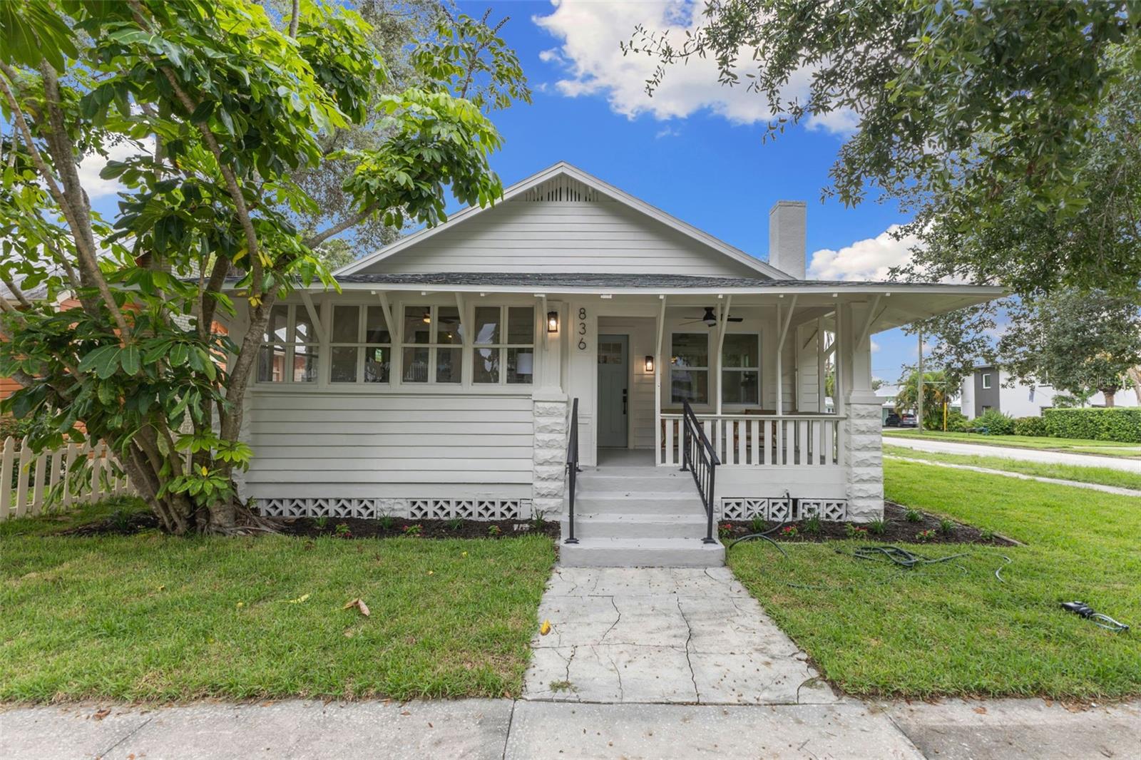 Nestled in the heart of Historic Uptown, just minutes from Downtown St. Pete, this restored historic home blends character with modern upgrades. Behind its historic façade, you’ll find peace of mind with a brand-new roof, plumbing, HVAC system, impact windows, and a tankless water heater—ensuring long-term comfort and efficiency. The home retains its original hardwood flooring, carefully restored to showcase its charm, while new GE stainless steel appliances, quartz countertops, and a gas range bring luxury into the kitchen. Redesigned bathrooms and stylish finishes throughout provide a fresh, modern aesthetic without compromising on authenticity. With no flood insurance required (Flood Zone X) and no damage from last year’s storms, this property offers both security and convenience. Step outside and enjoy the walkability to local coffee shops, parks, restaurants, and all the vibrant amenities that make Uptown so desirable. Combining history, location, and modern function, this home captures the very best of St. Pete living.