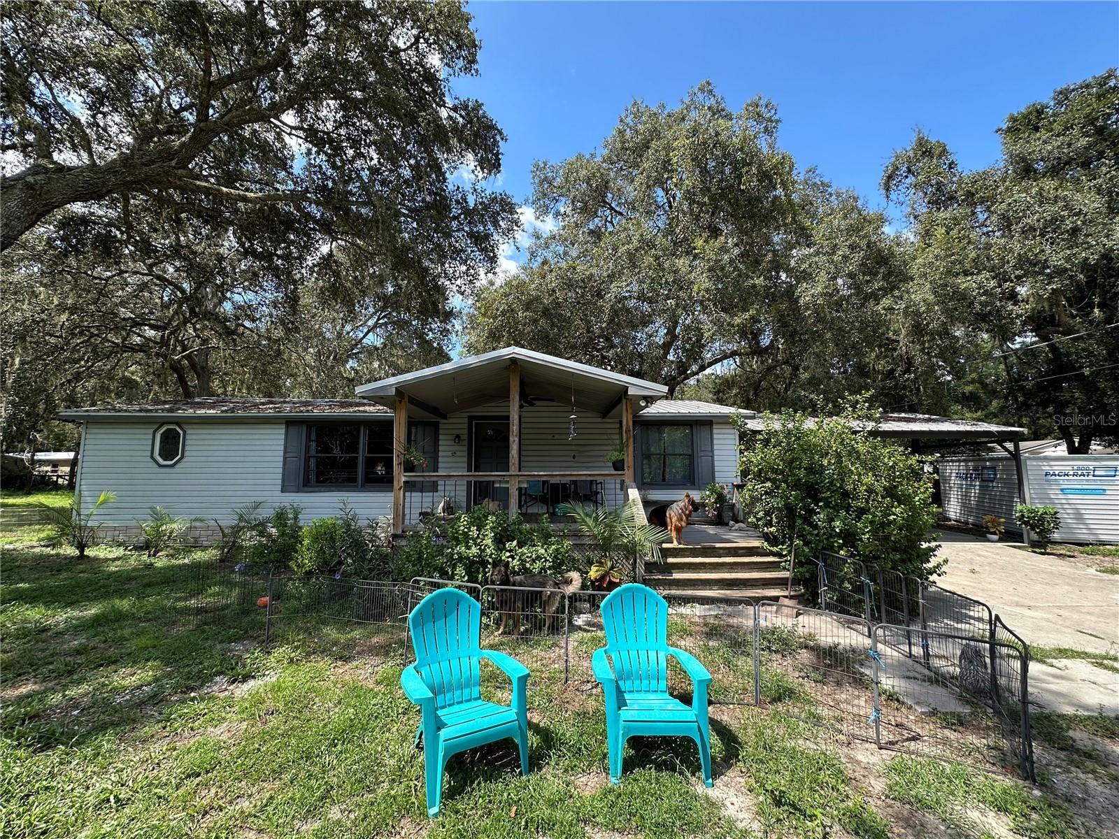 Enjoy the freedom of beautiful country living with no HOA on this 3.0 acre mini Farm completely fenced and cross fenced only minutes to the renowned world equestrian center! Conveniently located one mile off of Highway 40 set very far back on a quiet paved road. Surrounded by mature oak trees and open skies, this home features four bedrooms, two bathrooms, and a bonus room with many updates, along with generous living areas ideal for both relaxation and entertaining. Step outside to enjoy the expansive grounds with a 46x32 pole barn with electricity that can accommodate up to six or eight stalls if you need, a 20x20 enclosed shed with a concrete floor and electricity, a large covered front porch and a concrete driveway, a private 24x12 deck off the master suite, an attached 24x20 carport, a 12x12 chicken coop, an above ground pool with a 16x 20 attached deck, and plenty of space for animals, equipment, or expansion. Zoned A1 with the option to add another home on this high and dry acreage!