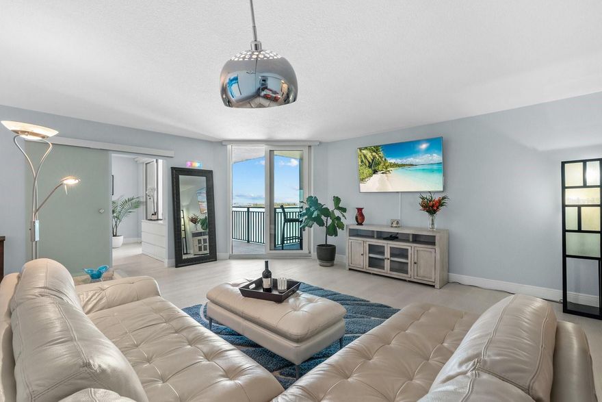 If you are dreaming of the ultimate condominium with jaw-dropping Gulf, Bay, and City Views, this is the one! No detail was overlooked in the design and layout of this incredible condo. Modern luxury on prime north Siesta Key oceanfront. Positioned on the 10th floor, with unsurpassed panoramic views of the Gulf, Sarasota Bay, the skyline of Sarasota, Lido Key, Big Pass and beyond. Watching dolphins and spectacular sunsets are some of the seller's favorite bonuses. Spacious open floor plan, which includes most of the high-end furnishings. One-bedroom, one-bathroom home in the sky that defines style. Masterfully renovated, maximizing spaces and views from every room. The modernization of the unit included a full remodel: Hurricane-resistant sliding glass doors, a complete new kitchen, including European style cabinets with soft-touch closing, convenient pullouts for storage, large porcelain wall tile, granite counters, triple filter osmosis water dispenser, and a full appliance package. Waterproof luxury wide vinyl plank flooring throughout. All new bath with dual sinks, shower with frameless shower doors, and water closet. A modern frosted glass barn door was added for additional access to the bedroom. A newer electrical box with updated GFI wiring will give a new owner peace of mind. Motorized privacy blinds on the sliding glass doors, with a touch of a remote. 4822 Ocean Blvd has had extensive updates recently, including a remodeled social/club room, fitness center, heated waterfront pool, outdoor grills within an extra large Cabana, fishing pier, social pier, bicycle storage room, and new terraces and railings on every condominium. In 2021, a modern lobby was created with high-end furnishings, and a secured entrance, featuring a new updated security system for the community. A new sea wall is being constructed, along with 2 new piers; expected completion date is the end of February, 2026. Be sure to ask about the covered parking process; assigned parking, with extra parking behind gates, including guest parking. Additional amenities include a secured fishing room to store fishing equipment, and a large park. Wi-Fi, cable, water, and trash, and more are included in the HOA fee. Located within a short walk to Siesta Key Village, and Siesta Key Beach. Enjoy all the Island has to offer with its restaurants, shopping and activities. Come for the views and stay for the fun!