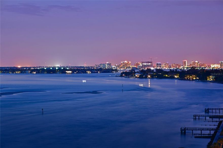 If you are dreaming of the ultimate condominium with jaw-dropping Gulf, Sarasota Bay, and City Views, this is the one! No detail was overlooked in the design and layout of this incredible condo. Modern luxury on prime north Siesta Key Oceanfront. Positioned on the 10th floor, with unsurpassed panoramic views of the Gulf, Sarasota Bay, the skyline of Sarasota, Lido Key, Big Pass and beyond. Watching dolphins and spectacular sunsets are some of the seller's favorite bonuses. Spacious open floor plan, which includes most of the high-end furnishings. One-bedroom, one-bathroom home in the sky that defines style. Masterfully renovated, maximizing spaces and views from every room. The modernization of the unit included a full remodel: Hurricane-resistant sliding glass doors, a completely new kitchen, including European style cabinets with soft-touch closing, convenient pullouts for storage, large porcelain wall tile, granite counters, triple filter osmosis water dispenser, and a full appliance package. Waterproof luxury wide vinyl plank flooring throughout. All new bath with dual sinks, shower with frameless shower doors, and water closet. A modern frosted glass barn door was added for additional access to the bedroom. A newer electrical box with updated GFI wiring will give a new owner peace of mind. Motorized privacy blinds on the sliding glass doors, with a touch of a remote. 4822 Ocean Blvd has had extensive updates recently, including a remodeled social/club room, fitness center, heated waterfront pool, outdoor grills within an extra-large Cabana, fishing pier, social pier, bicycle storage room, and new terraces and railings on every condominium. In 2021, a modern lobby was created with high-end furnishings, and a secured entrance, featuring a new updated security system for the community. A new sea wall has just finished being constructed, and two new piers are almost completed; Expected completion date is the end of February, 2026. Be sure to ask about the covered parking process; assigned parking, with extra parking behind gates, including guest parking. Additional amenities include a secured fishing room to store fishing equipment, and a large park. Wi-Fi, cable, water, and trash, and more are included in the HOA fee. Located within a short walk to Siesta Key Village, and Siesta Key Beach. Enjoy all the Island has to offer with its restaurants, bars, and shopping at various boutiques. There’s also a weekly farmer’s market. Be sure to check out the VIRTUAL TOURS on this property and see why you’ll fall in love with this exceptional Gulf-front gem! Come for the views and stay for the fun!