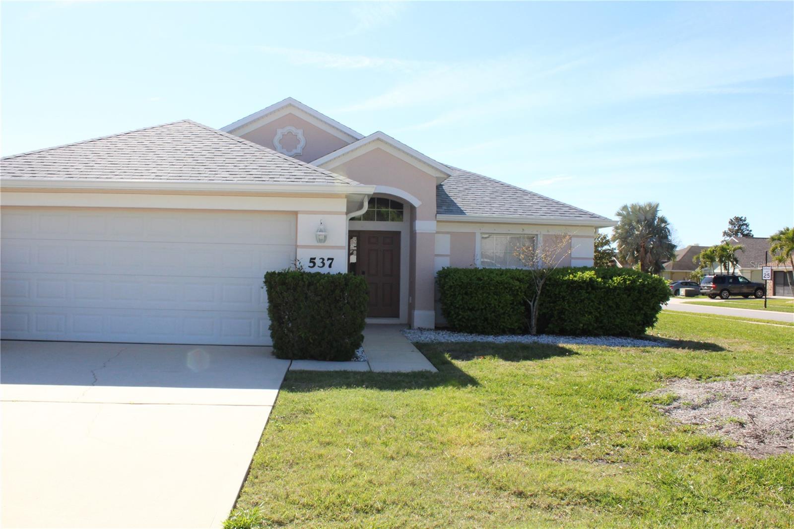 This lovely 3 bed/2 bath home with 2 car garage in sought after & gated Coral Trace, has a new roof installed at the end of August 2024 w/gutters. A new A/C system, new hot water heater and irrigation control box was installed in November 2024. The whole inside of the house has been freshly painted and new vinyl plank flooring was installed in the living room / dining room & bedrooms. This home must be seen to be appreciated. All measurements are approximate and information is deemed to be correct.